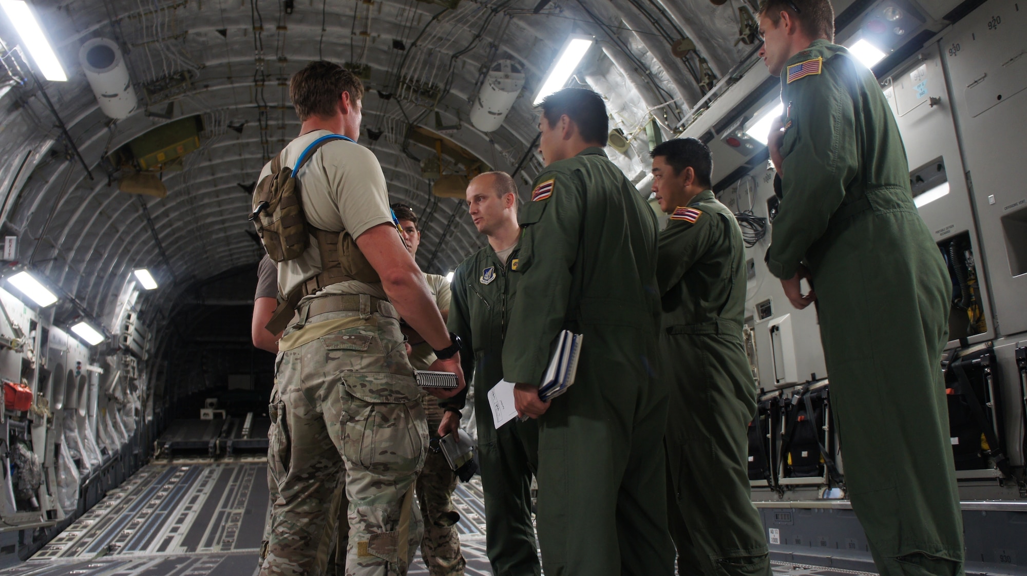 Pararescue jumpers with the 31st Rescue Squadron hold a pre-mission brief with the Air Crew from the Hawaii Air National Guards 204th and the 535th Airlift Squadron before a High Altitude Low Opening air drop during Balikatan 2016, Clark Air Field, Philippines, April 15, 2016. Balikatan, which means shoulder to shoulder in Filipino, is an annual bilateral training exercise aimed at improving the ability of Philippine and U.S. military forces to work together during planning, contingency and humanitarian assistance and disaster relief operations. (U.S. Air National Guard photo by Tech. Sgt. Andrew Jackson/released)

