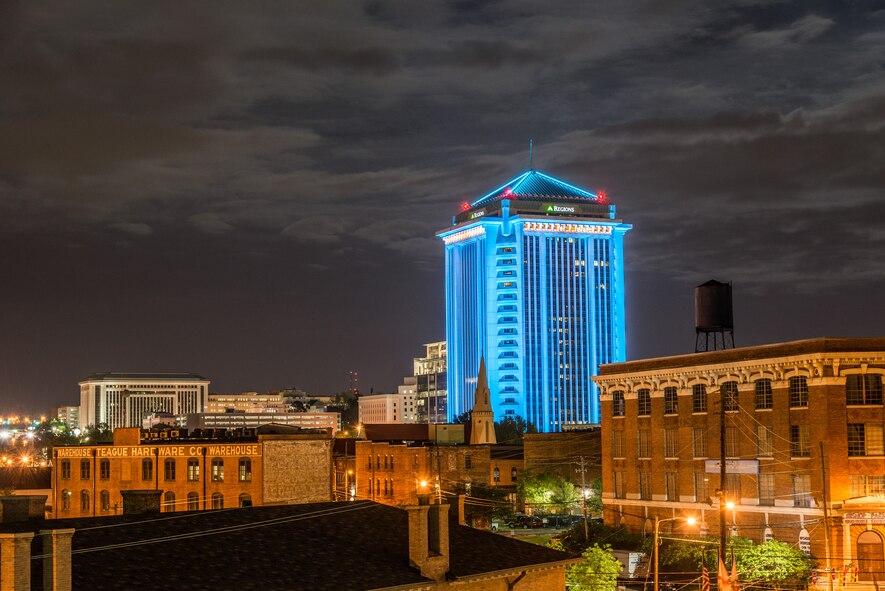 The Retirement Systems of Alabama Dexter Avenue building is illuminated in downtown Montgomery, Ala., April 20, 2016. LaNessa Howard, Sexual Assault Response Coordinator, coordinated with the building administrators to illuminate the structure teal for Sexual Assault Awareness Month. (U.S. Air Force photo/Trey Ward)