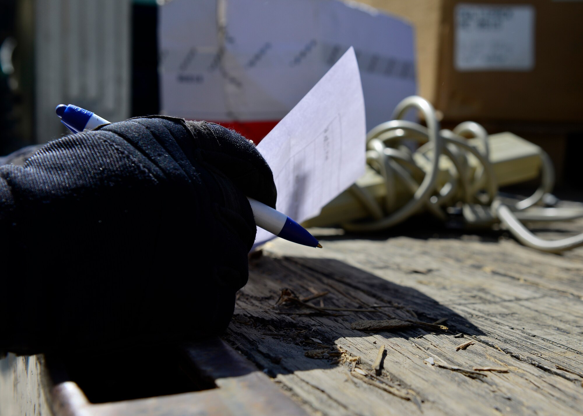 A Defense Logistics Agency member checks off disposed items during the spring clean event, April 19-22, 2016, at Aviano Air Base, Italy. The DLA accepts unneeded office furniture, refrigerators, cables, computer parts, scrap metal and appliances for disposition to save the Air Force and Department of Defense money. (U.S. Air Force photo by Airman 1st Class Cary Smith/Released)