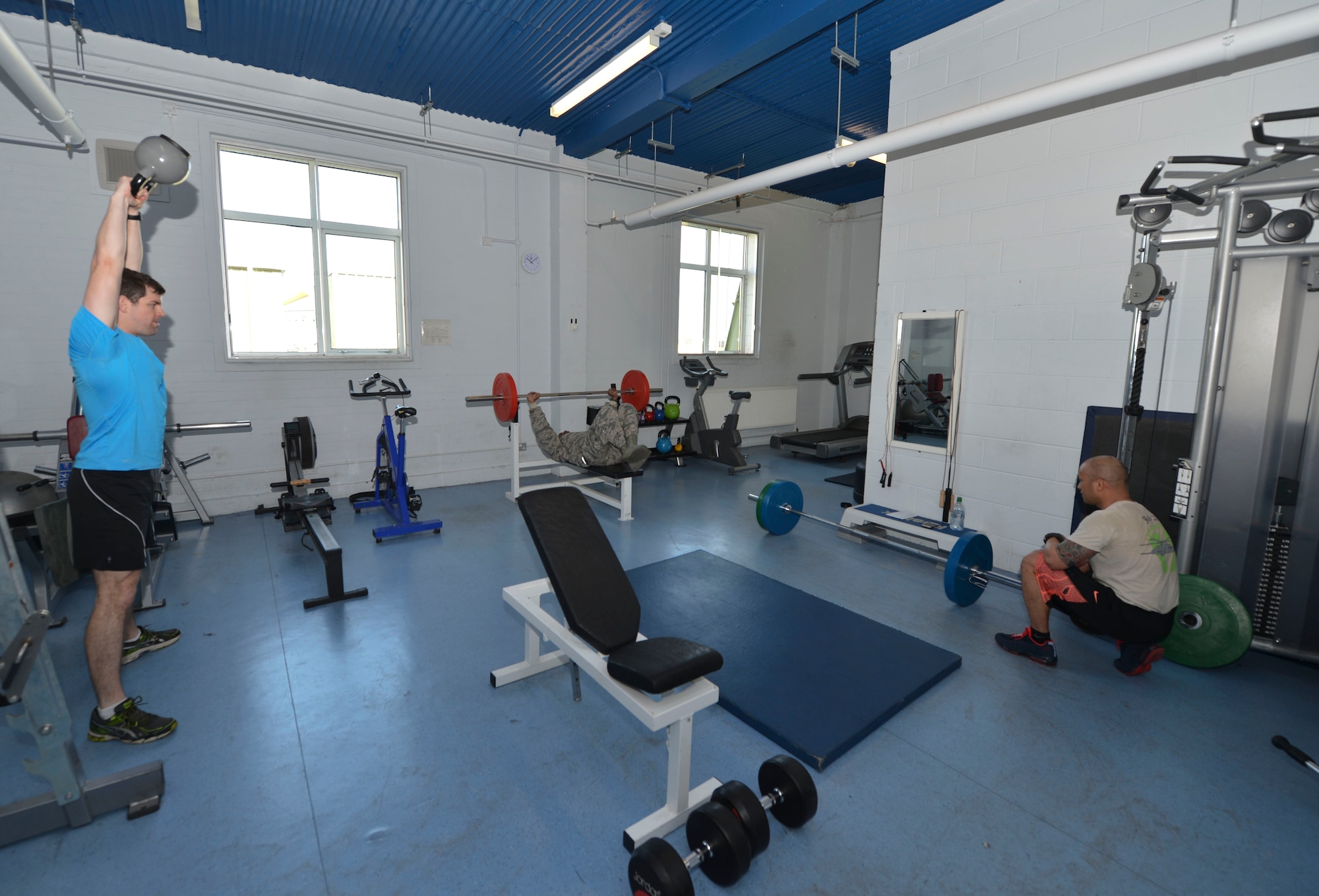 Airmen from the 56th Rescue Squadron and the 748th Maintenance Squadron, workout in the Mountain Rescue Service gym at Royal Air Force Lossiemouth, Scotland, April 12, 2016. Airmen train in various forms of exercise during the week to increase strength, endurance and stamina. (U.S. Air Force photo/Senior Airman Nigel Sandridge)