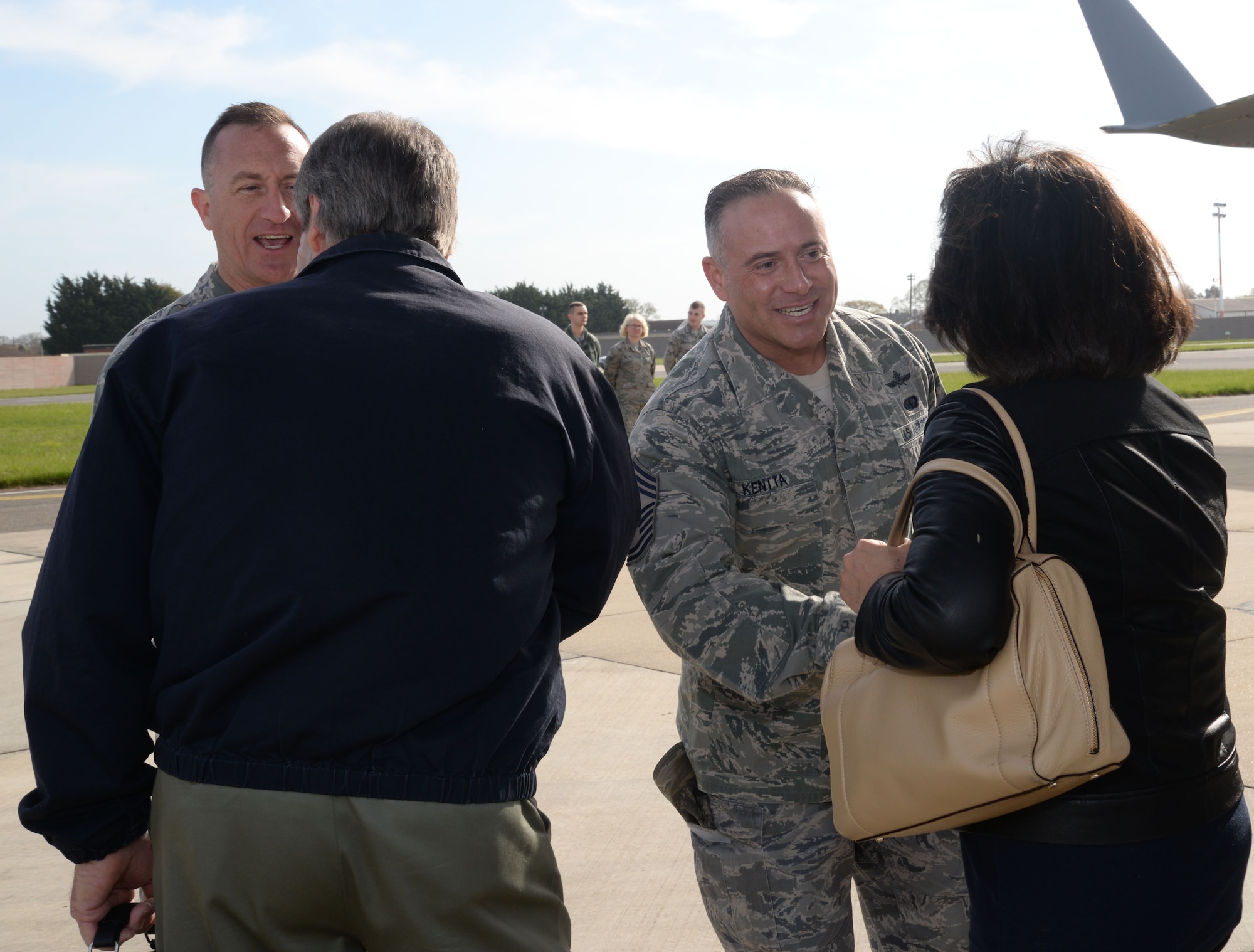 U.S. Air Force Col. Nathan Green, 752nd Special Operations Group commander, left, and U.S. Air Force Chief Master Sgt. Brian Kentta, 48th Mission Support Group superintendent, greet distinguished visitors April 21, 2016, as they arrive on RAF Mildenhall, England. The civic leaders toured both RAF Mildenhall and RAF Lakenheath to learn about their missions and to meet Airmen. (U.S. Air Force photo by Senior Airman Justine Rho/Released)