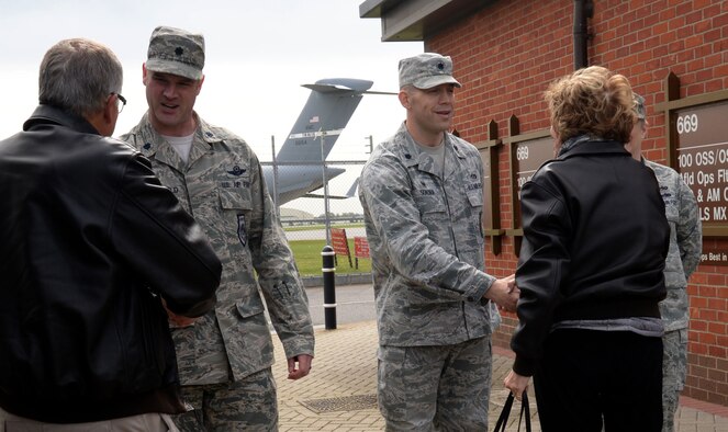 U.S. Air Force Lt. Col. Jay Butterfield, 100th Operations Support Squadron commander, left, and U.S. Air Force Lt. Col. Brandon Sokora, 100th Civil Engineering Squadron commander, greet civic leaders April 21, 2016, as they arrive at the 100th OSS Air Traffic Control tower on RAF Mildenhall, England. The attendees of the AF Civic Leader Program visited the ATC tower and the 100th CES fire department to learn about their mission and meet Airmen. (U.S. Air Force photo by Senior Airman Justine Rho/Released)
