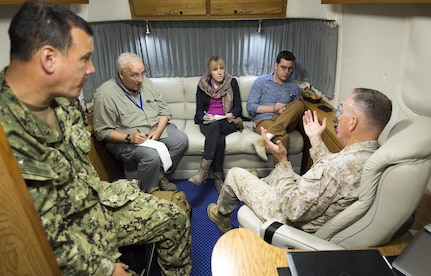 Reporters interview Marine Corps Gen. Joe Dunford, chairman of the Joint Chiefs of Staff, inside the "Silver Bullet" aboard a C-17 Globemaster III while enroute to Cairo from Irbil, Iraq, April 22, 2016. Dunford visited Iraq to assess the campaign against the Islamic State of Iraq and the Levant. DoD photo by Navy Petty Officer 2nd Class Dominique A. Pineiro