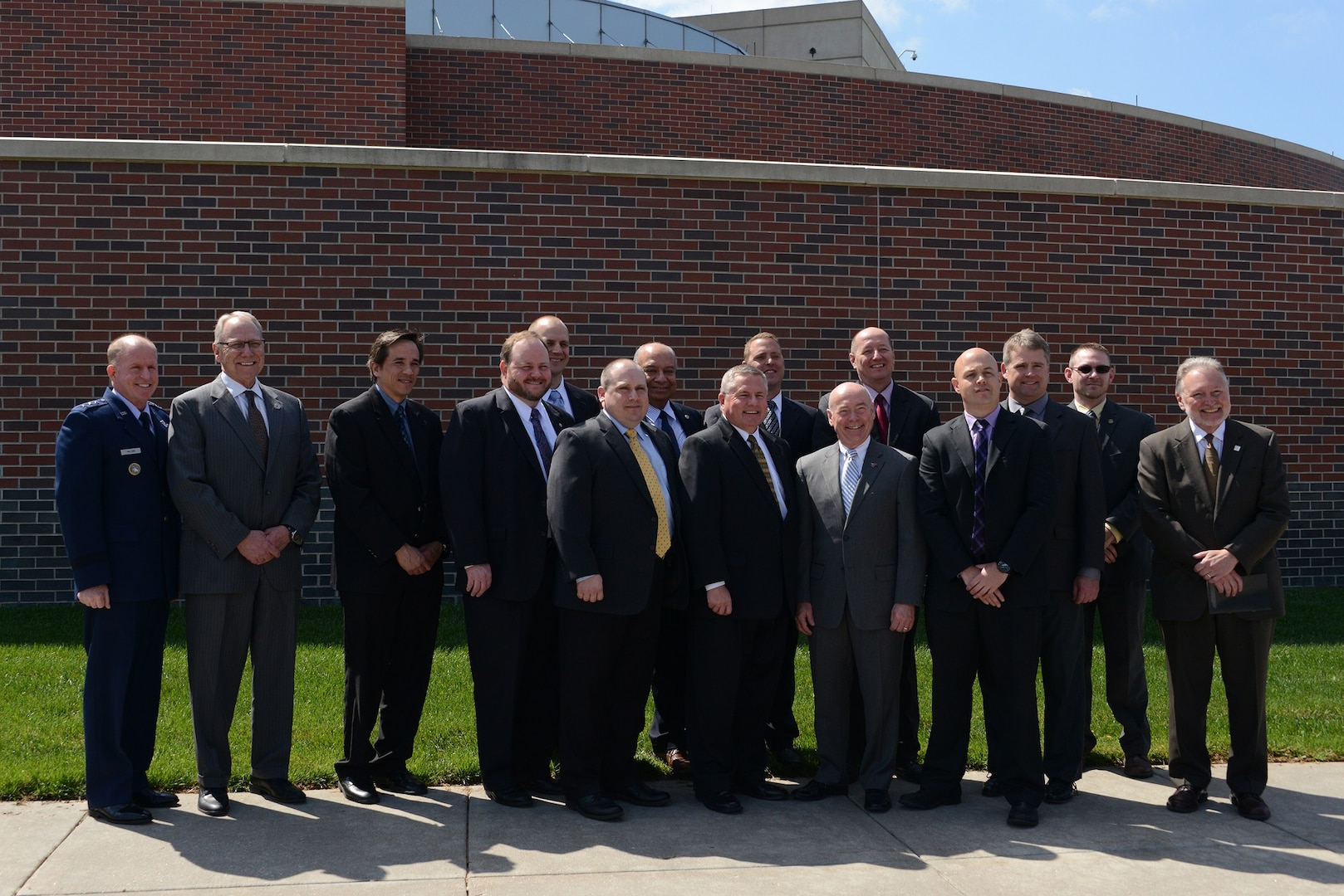 U.S. Air Force Lt. Gen. Stephen W. Wilson, U.S. Strategic Command (USSTRATCOM) deputy commander (left); Dr. John Christensen, University of Nebraska at Omaha (UNO) chancellor (second from left); Dr. Louis Pol, UNO College of Business Administration dean (right); Dr. Hesham Ali, UNO College of Information, Science and Technology dean (back row, center); and Mike Kemp, UNO associate athletic director (front row, sixth from right); pose for a photo with the 10 USSTRATCOM Strategic Leader Fellows Program participants after their graduation ceremony at the Peter Kiewit Institute in Omaha, Neb., April 22, 2016. During the event, Wilson and other senior leaders from the command joined University of Nebraska senior leaders and faculty in recognizing the Fellows for completing the 13-week program. While at UNO, the Fellows learned mission-oriented skills from national security and defense experts from the University of Nebraska in a classroom-based, hands-on environment. This year marked the first time that all four University of Nebraska campuses [UNO, the University of Nebraska Medical Center, the University of Nebraska at Lincoln and the University of Nebraska at Kearney] were involved in the program. The Strategic Leadership Fellows Program was launched in March 2014 as an initiative under the University of Nebraska's National Strategic Research Institute (NSRI), one of only 13 Department of Defense-sponsored University Affiliated Research Centers (UARCs) in the nation. One of nine DoD unified combatant commands, USSTRATCOM has global strategic missions, assigned through the Unified Command Plan, which include strategic deterrence; space operations; cyberspace operations; joint electronic warfare; global strike; missile defense; intelligence, surveillance and reconnaissance; combating weapons of mass destruction; and analysis and targeting. (USSTRATCOM photo by U.S. Air Force Staff Sgt. Jonathan Lovelady)