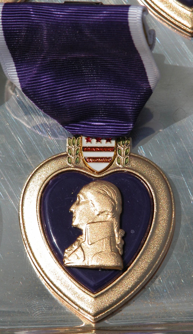 George Washington, commander of the Continental Army during the Revolutionary War and the first president of the United States, originated the Purple Heart Medal. After the American colonists had won their freedom from England, the medal was discontinued until it was revived in 1932. During his trip to Iraq on April 22, 2016, Marine Corps Gen, Joe Dunford, the chairman of the Joint Chiefs of Staff, awarded Purple Heart medals to four Marines wounded during the Islamic State of Iraq and the Levant attack on Fire Base Bell in March. DoD photo by Gerry J. Gilmore