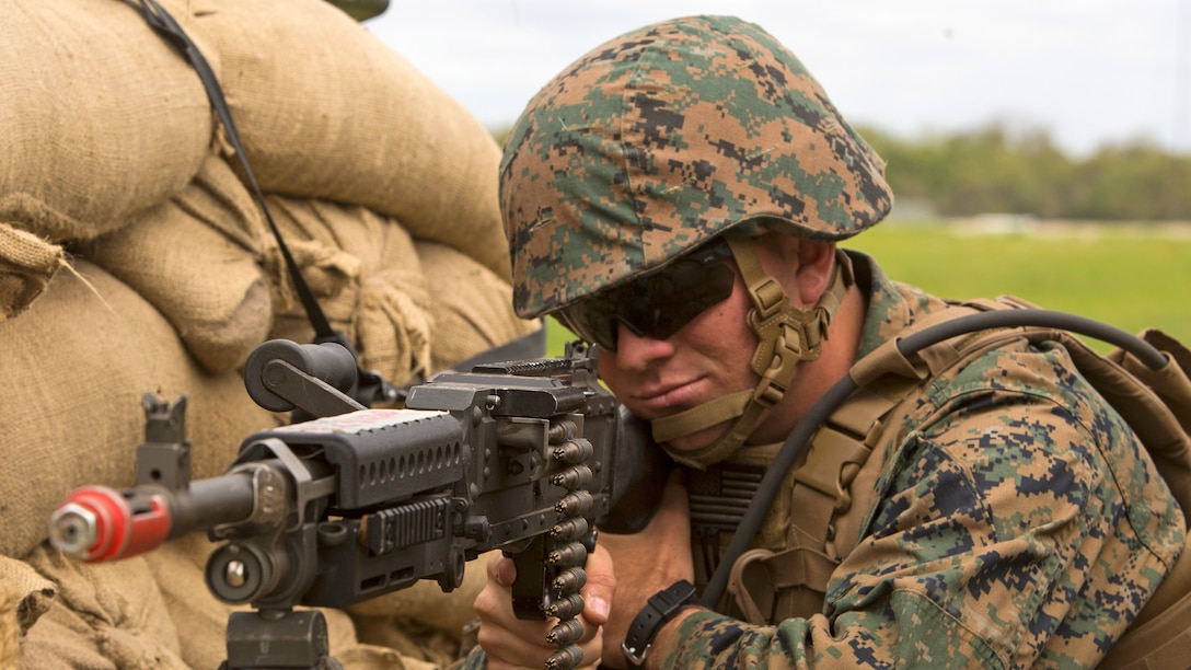 Pfc. Garrett Cone, a rifleman with 1st Platoon, Bravo Company, 2nd Law Enforcement Battalion, sights-in with the scope of his M240B machine gun while manning a security post during the II Marine Expeditionary Force Command Post Exercise 3 at Marine Corps Base Camp Lejeune, North Carolina, April 20, 2016. During the CPX, 2nd LEB posted security around the campsite and defended it from mock enemies, ensuring the headquarters element could complete the mission safely.