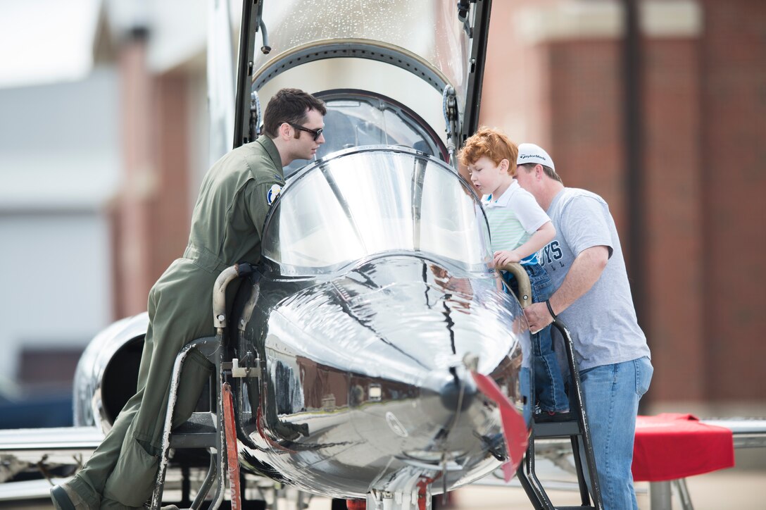 A U.S. Air Force pilot introduces a T-38 Talon to a young spectator at the AirPower over Hampton Roads Open House at Langley Air Force Base, Va., April 23, 2016. The open house gave military and civilian personnel the opportunity to get up-close-and-personal with various aircraft and witness the Air Force’s past and present airpower capabilities. (U.S. Air Force photo by Senior Airman Kayla Newman)