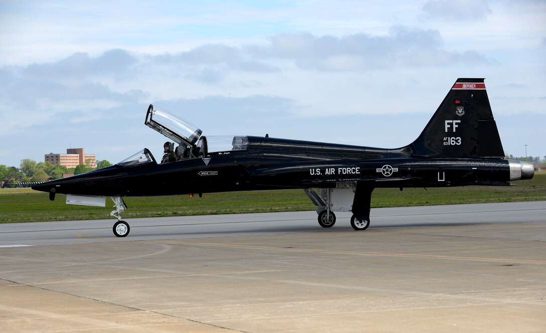 A U.S. Air Force pilot waves from a T-38 Talon during the AirPower over Hampton Roads Open House at Langley Air Force Base, Va., April 23, 2016. Heritage Flight performances display Air Force airpower history and honor the brave men and women who have served, or are currently serving. (U.S. Air Force photo by Staff Sgt. Teresa J. Cleveland)