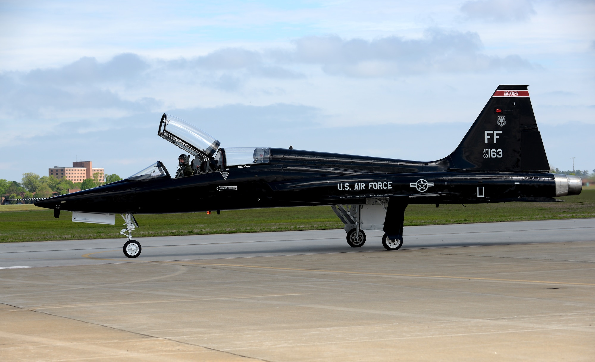 A U.S. Air Force pilot waves from a T-38 Talon during the AirPower over Hampton Roads Open House at Langley Air Force Base, Va., April 23, 2016. Heritage Flight performances display Air Force airpower history and honor the brave men and women who have served, or are currently serving. (U.S. Air Force photo by Staff Sgt. Teresa J. Cleveland)
