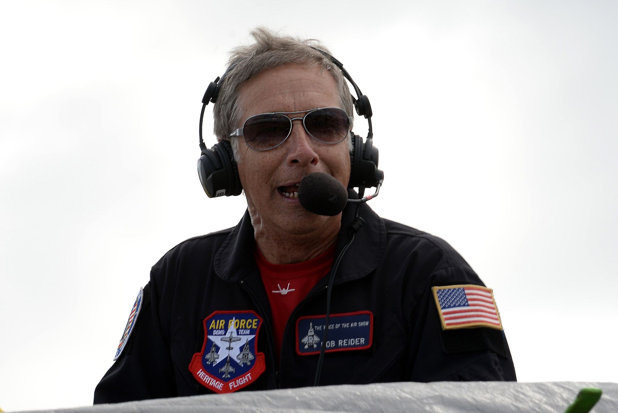 Rob Reider, program announcer for the U.S. Air Force Heritage Flight, introduces performers during the AirPower over Hampton Roads Open House at Langley Air Force Base, Va., April 23, 2016. Heritage Flight performances display Air Force airpower history and honor the men and women who have served, and are currently serving. (U.S. Air Force photo by Staff Sgt. Teresa J. Cleveland/Released)