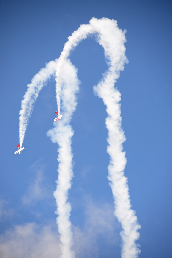 Aerial performers fly overhead during the AirPower over Hampton Roads Open House at Langley Air Force Base, Va., April 23, 2016. Aerial performances featured the Air Combat Command F-22 Demonstration Team, U.S. Air Force Thunderbirds, U.S. Army Golden Knights parachute team and many more. (U.S. Air Force photo by Staff Sgt. Teresa J. Cleveland)