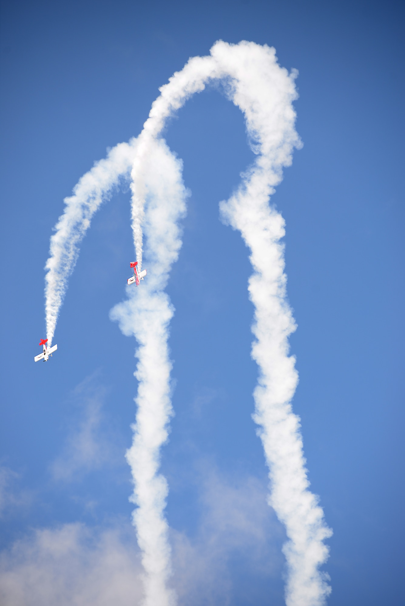 Aerial performers fly overhead during the AirPower over Hampton Roads Open House at Langley Air Force Base, Va., April 23, 2016. Aerial performances featured the Air Combat Command F-22 Demonstration Team, U.S. Air Force Thunderbirds, U.S. Army Golden Knights parachute team and many more. (U.S. Air Force photo by Staff Sgt. Teresa J. Cleveland)