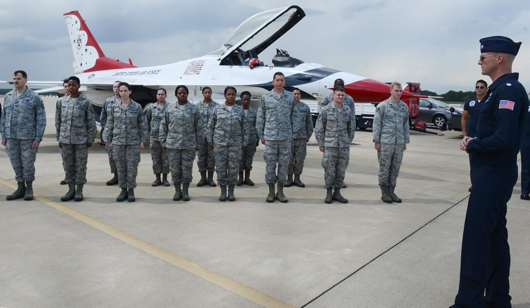 U.S. Air Force Lt. Col. Chris Hammond, the commander and lead pilot of the U.S. Air Force Thunderbirds, speaks to Airmen during a re-enlistment ceremony during the AirPower over Hampton Roads Open House at Langley Air Force Base, Va., April 22, 2016. Fifteen Airmen re-enlisted during the ceremony. (U.S. Air Force photo by Staff Sgt. Teresa J. Cleveland)