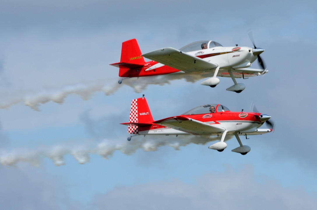 RedLine AirShows flyers perform aerobatic tricks during the AirPower over Hampton Roads Open House at Langley Air Force Base, Va., April 23, 2016. The RedLine aircraft are Van’s RV8s used to perform dynamic two-ship formation shows. (U.S. Air Force photo by Staff Sgt. Natasha Stannard)