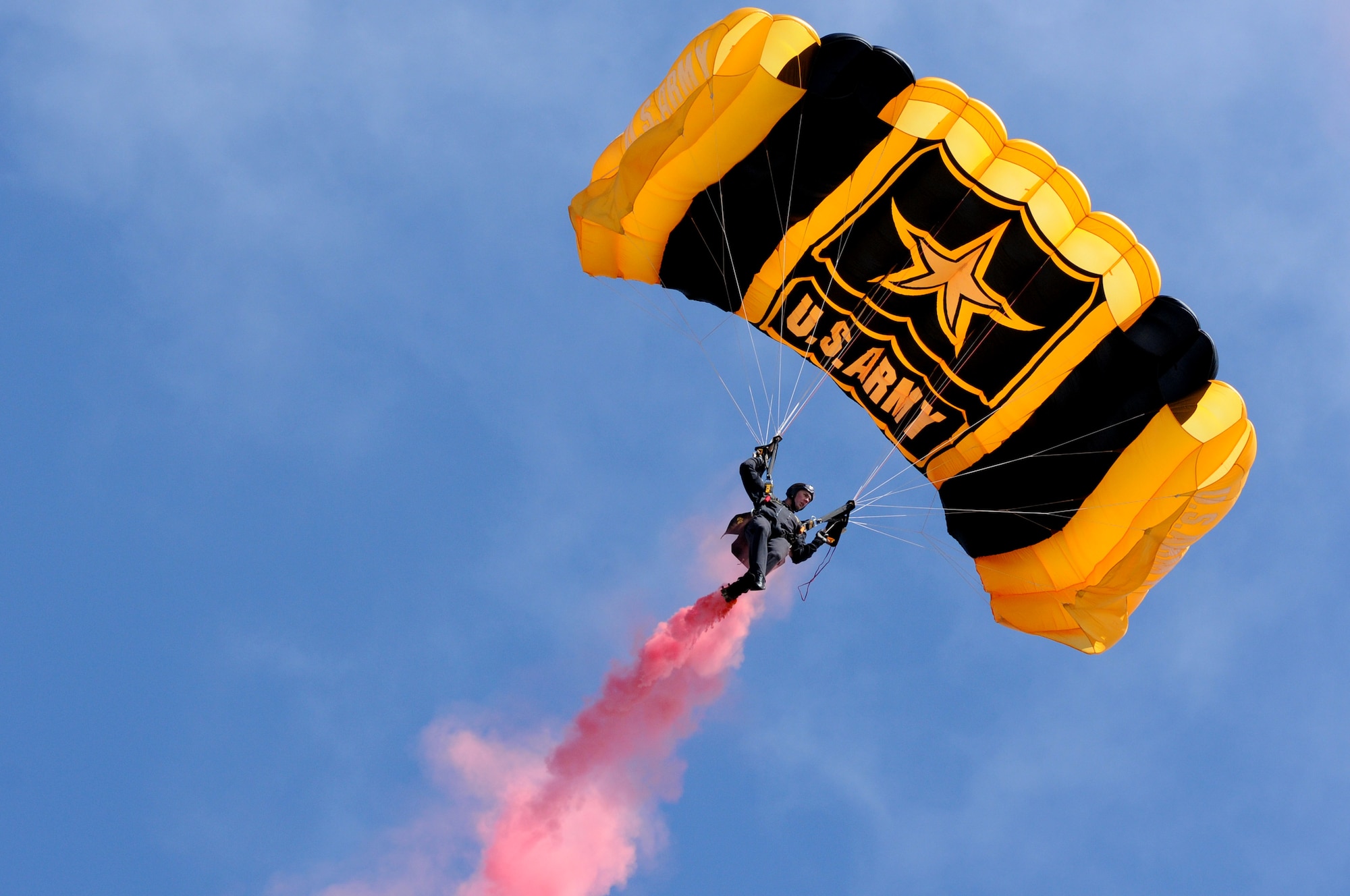 A member of U.S. Army Golden Knights parachute team descends from a jump during AirPower over Hampton Roads Open House at Langley Air Force Base, Va., April 23, 2016. The Golden Knights led the show’s opening ceremony. (U.S. Air Force photo by Staff Sgt. Natasha Stannard)