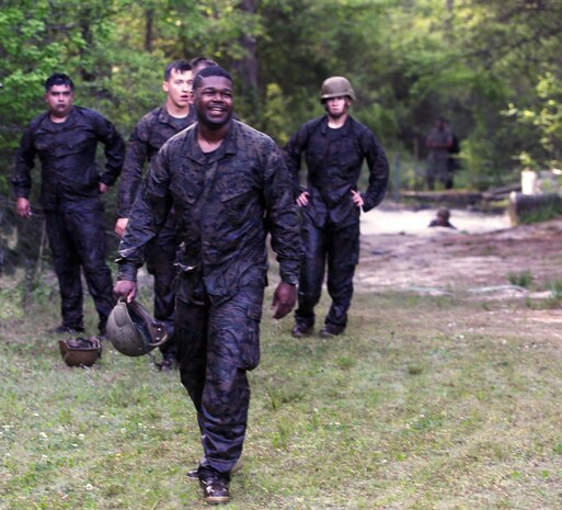 A group of Marines with Combat Logistics Regiment 2 completes an endurance course at Camp Lejeune, N.C., April 22, 2016. The unit pushed through the grueling 3.4 mile course to improve their ability to work as a team and to build camaraderie.