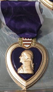 During his trip to Iraq on April 22, 2016, Marine Corps Gen. Joe Dunford, the chairman of the Joint Chiefs of Staff, awarded Purple Heart Medals to four Marines wounded during the Islamic State of Iraq and the Levant attack on Fire Base Bell in March. DoD photo by Gerry J. Gilmore 