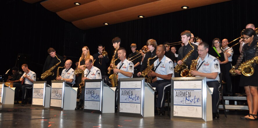 NAVAL AIR STATION FORT WORTH JOINT RESERVE BASE, Texas – Airmen of Note musicians, an Air Force Band ensemble, perform two songs with students from Boswell High School in Fort Worth, Texas, April 19, as part of its Advancing Innovation through Music program. Designed to build positive relationships with local and nationwide educational communities, the AIM program gives Air Force Band members the chance to work side-by-side with students of all ages, in small clinics and in large-scale assemblies. (U.S. Air Force photo by Julie Briden-Garcia)   