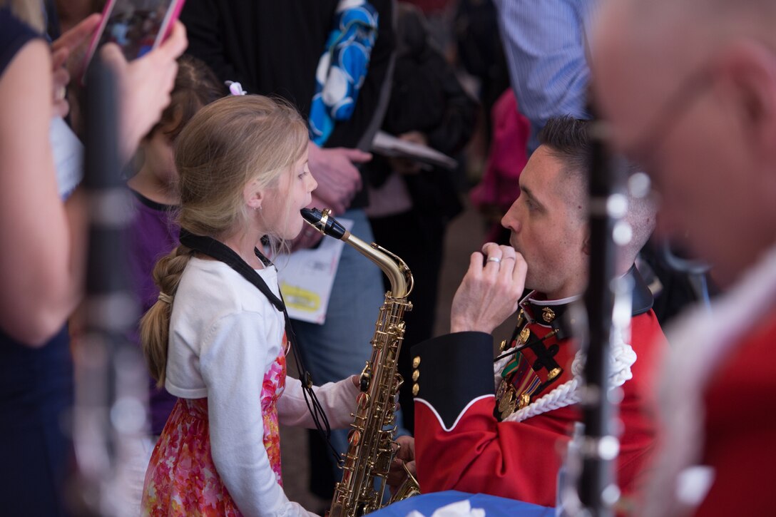 The Marine Band performed the Young People's Concert: Meet the Band, which included an instrument petting zoo, on Sunday, April 24, at Northern Virginia Community College's Rachel M. Schlesinger Concert Hall and Arts Center in Alexandria, Va. (USMC photo by Staff Sgt. Brian Rust/released).