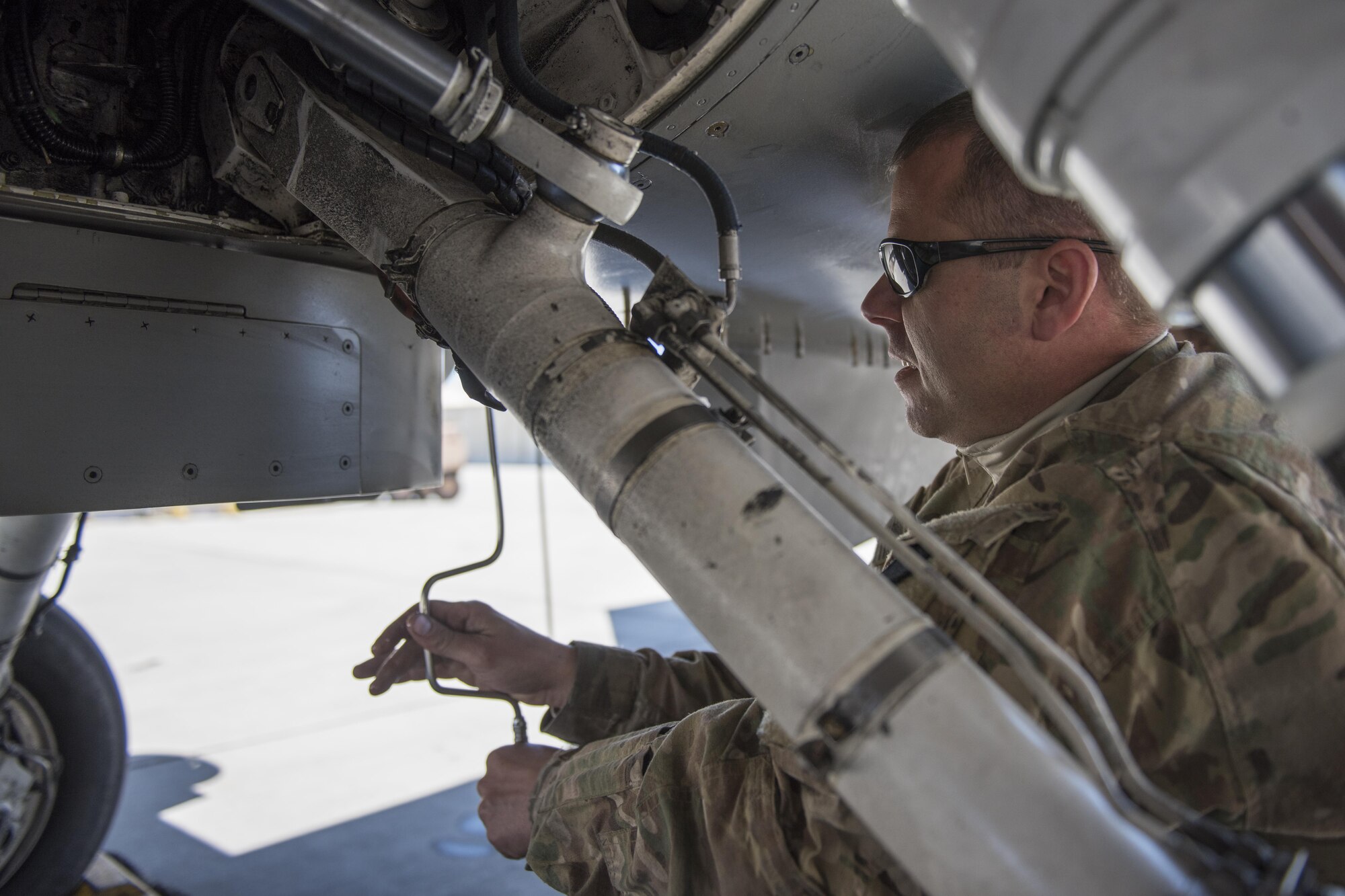 Tech. Sgt. Kevin Conklin, 455th Expeditionary Aircraft Maintenance Squadron electrical and environmental systems technician, replaces a panel on an F-16 Fighting Falcon from the 421st Expeditionary Fighter Squadron at Bagram Airfield, Afghanistan, April 23, 2016. The squadron provides combat-ready aircraft to the air component commander in support of coalition forces throughout Afghanistan. (U.S. Air Force photo/Tech. Sgt. Robert Cloys)