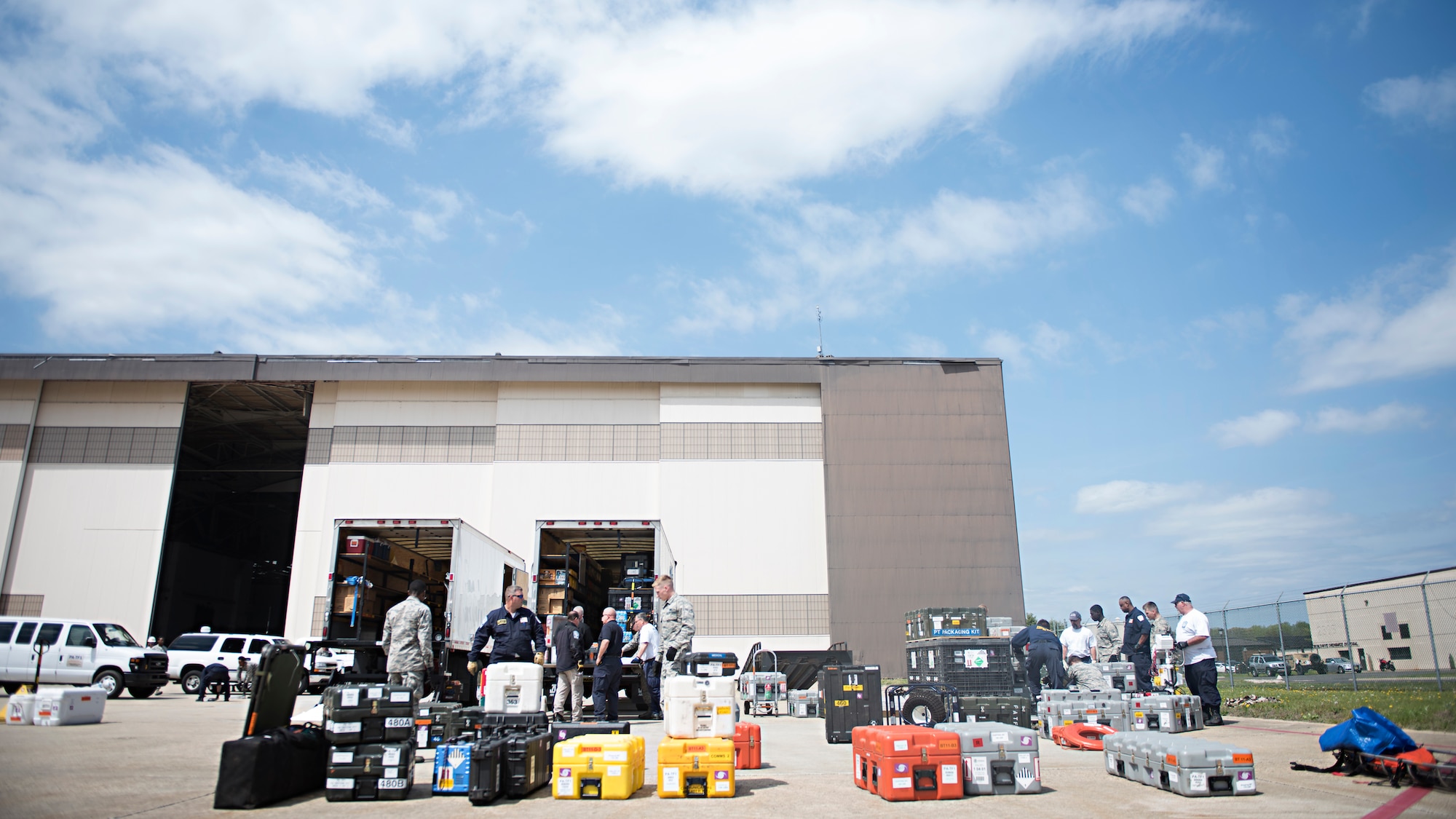 Members of the 305th Aerial Port Squadron and Federal Emergency Management Agency Pennsylvania Task Force 1 load cargo onto pallets during training April 21, 2016 at Joint Base McGuire-Dix-Lakehurst, N.J. Mobile teams consisting of approximately 80 personnel, trained in search and rescue, extraction and triage care, as well as relief workers deploy to aid the affected community. Joint Base MDL is Pennsylvania Task Force 1’s point of departure should they need to be airlifted.  (U.S. Air Force photo by Staff Sgt. Katherine Tereyama)