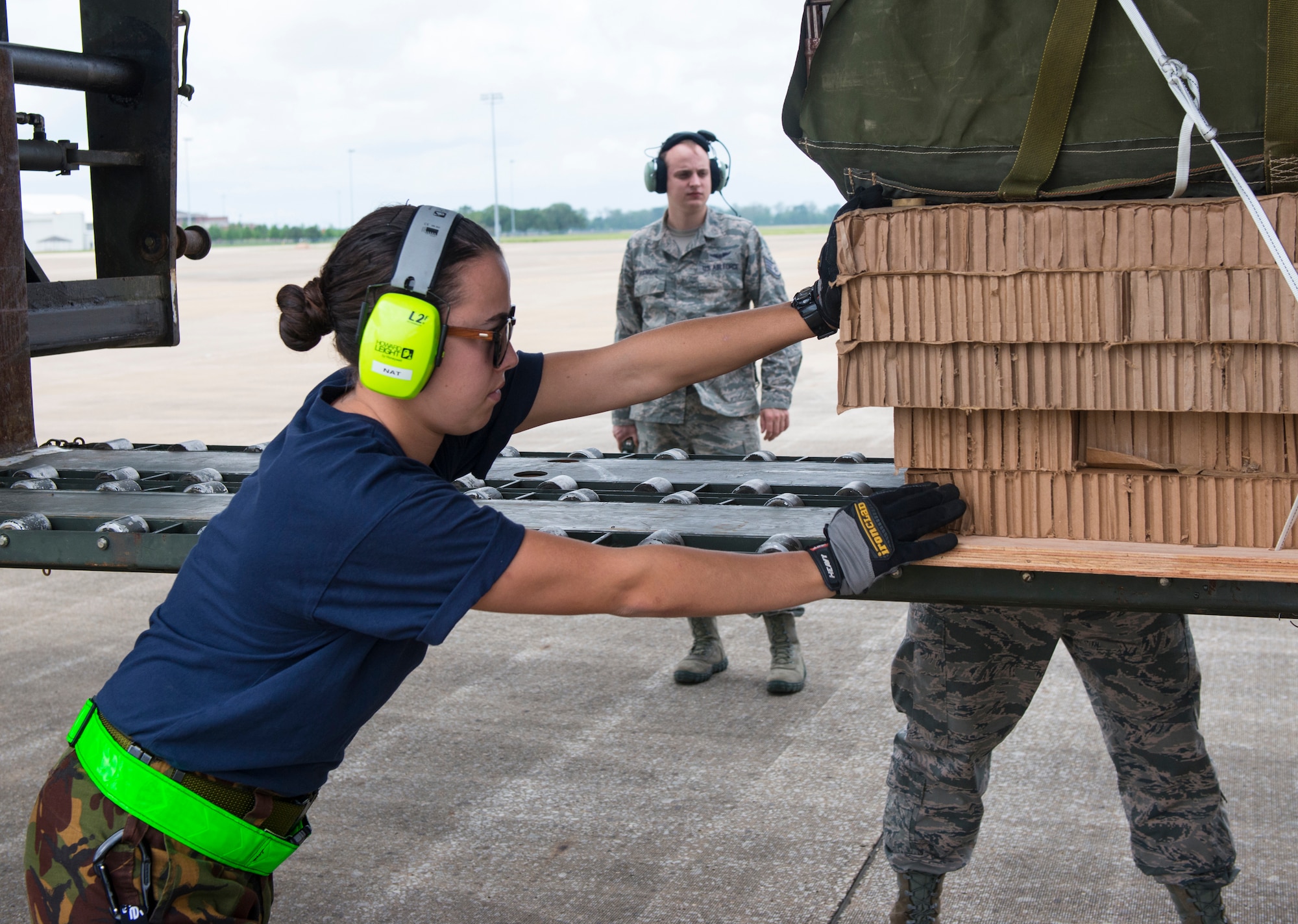 Leading Aircraftsmen Natalie Ferrell, Royal New Zealand air force air movements, loads cargo onto a C-130 Hercules during a Joint Readiness Training exercise at Alexandria International Airport, La. April 20, 2016. JRTC is a multinational exercise focused on pre-deployment and airdrop capabilities. (U.S. Air Force photo by Senior Airman Joshua King)