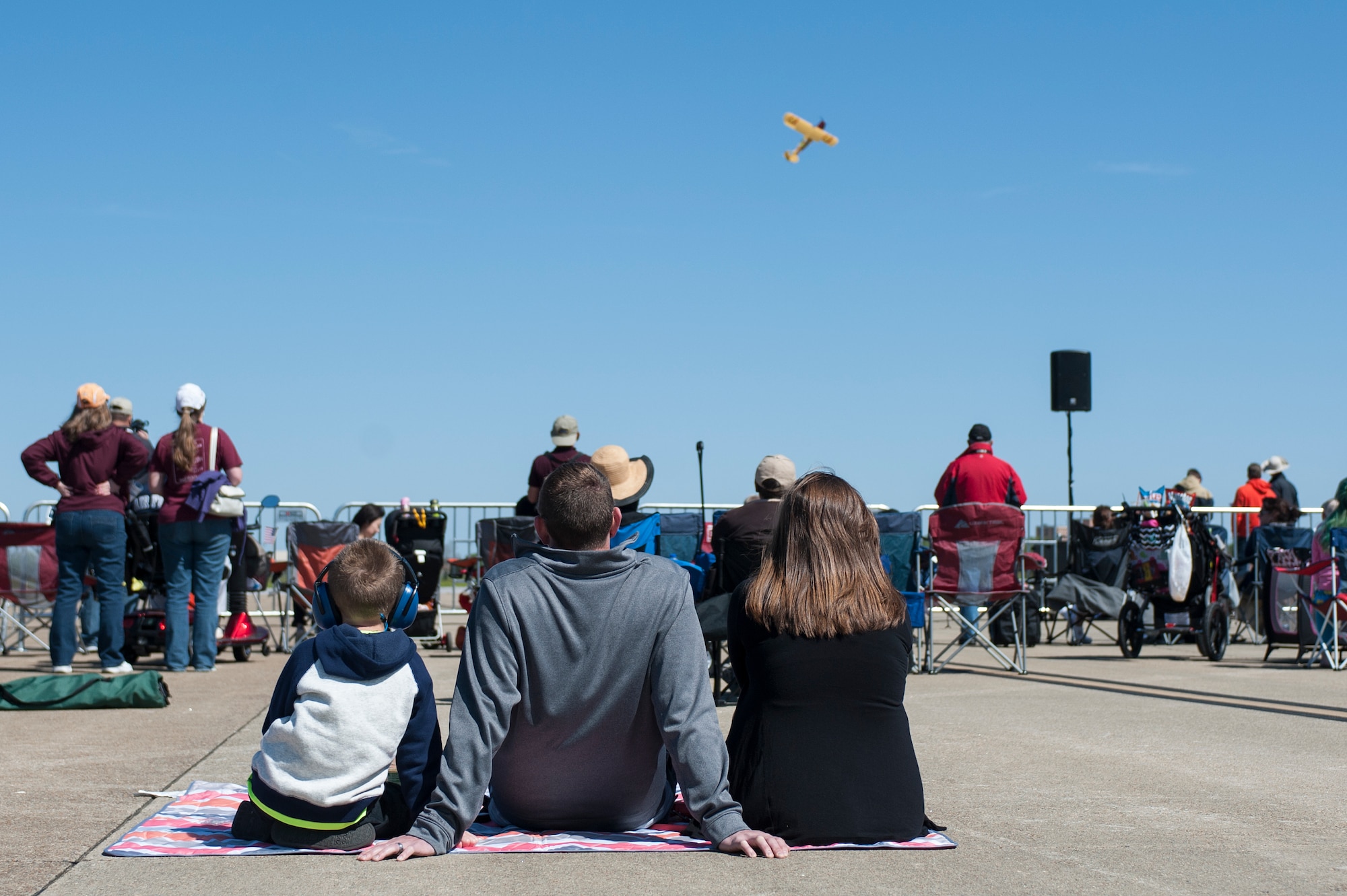 AirPower over Hampton Roads Open House patrons watch a comedy airshow at Langley Air Force Base, Va., April 24, 2016. The comedy act featured a detached wing flap and rooftop landing on an RV. (U.S. Air Force photo by Airman 1st Class Kaylee Dubois)