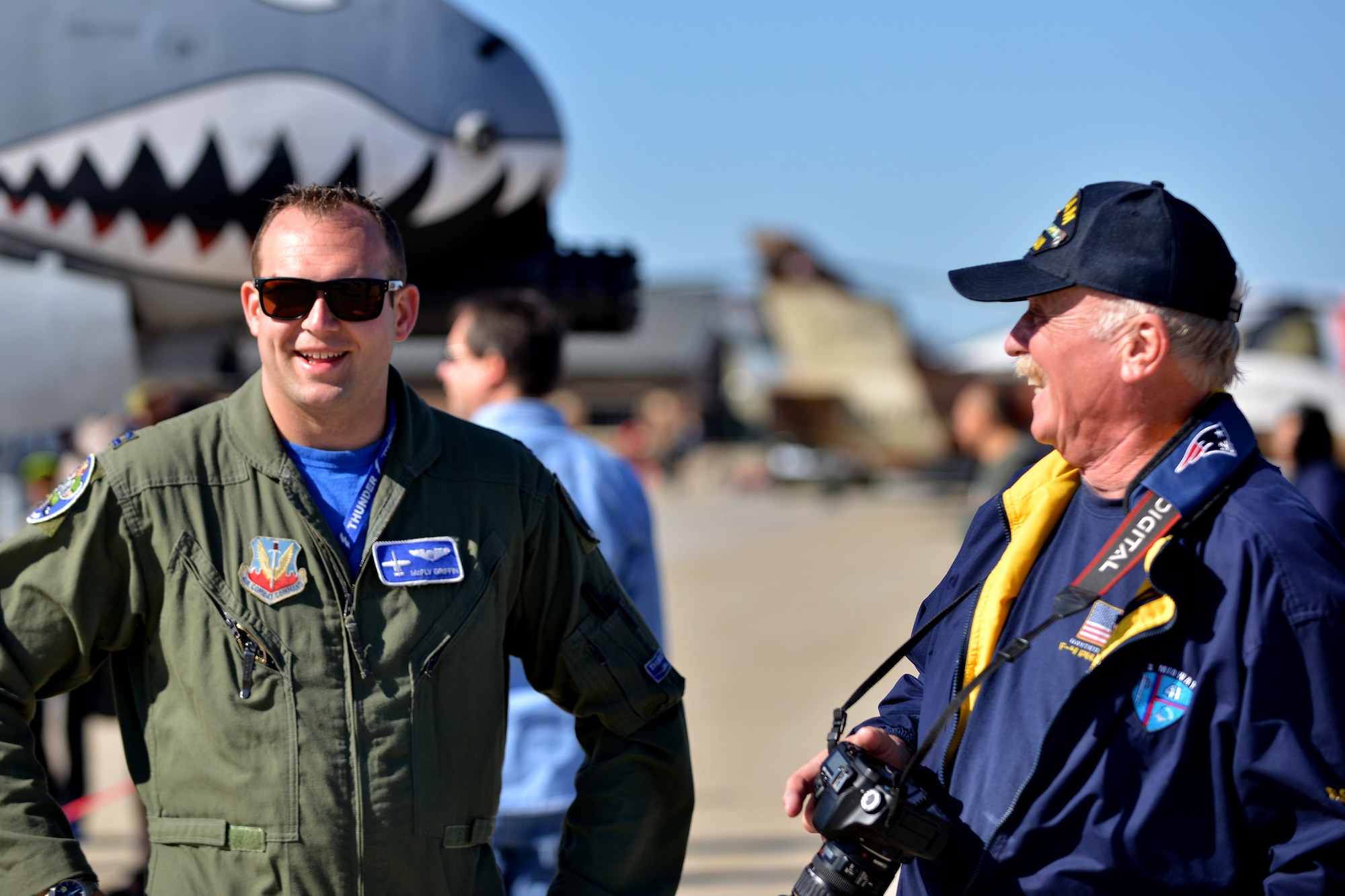 An A-10 Thunderbolt II pilot speaks with an AirPower over Hampton Roads Open House attendee at Langley Air Force Base, Va., April 24, 2016. Along with performances, the event allowed for visitors to view and learn about other aircraft through static displays and subject matter experts. (U.S. Air Force photo by Staff Sgt. Natasha Stannard)