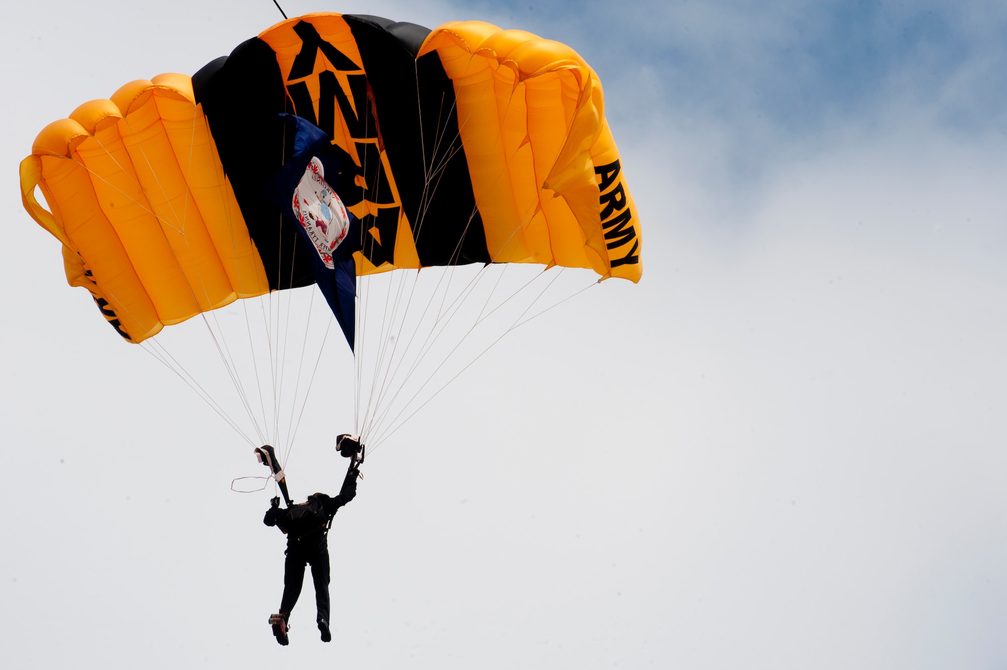 A U.S. Army Golden Knights parachute team member prepares to land during the AirPower over Hampton Roads Open House at Langley Air Force Base, Va., April 23, 2016. The team is composed of approximately 95 men and women, which include four parachute units, an aviation unit and a headquarters. (U.S. Air Force photo by Senior Airman R. Alex Durbin)