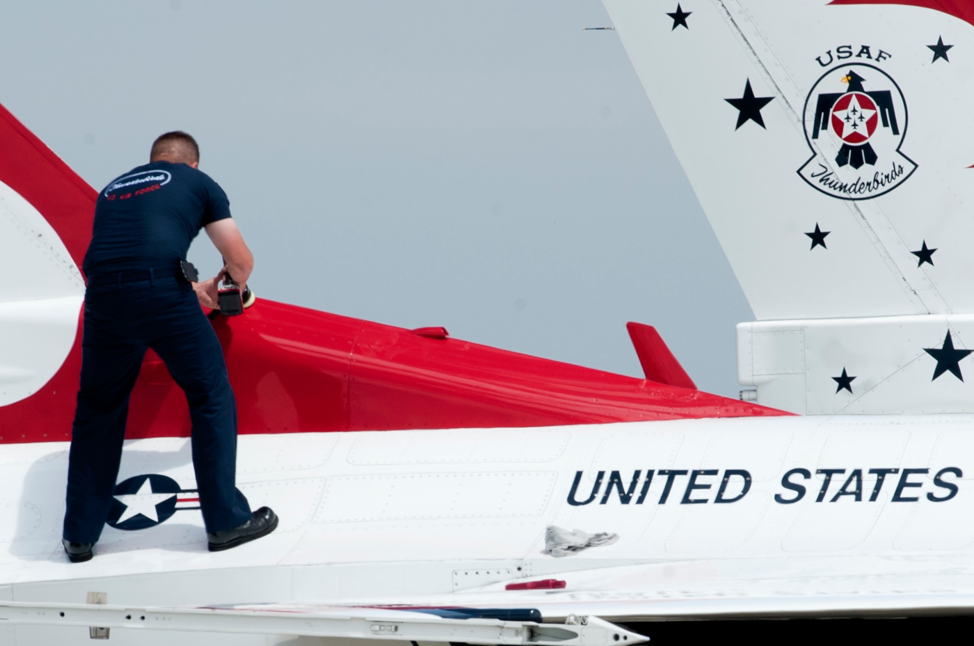 A U.S. Air Force Thunderbirds aerial demonstration team member buffs a jet during the AirPower over Hampton Roads Open House at Langley Air Force Base, Va., April 23, 2016. The Thunderbirds show consists of 24 professionals in various aircraft maintenance specialties. (U.S. Air Force photo by Senior Airman R. Alex Durbin)