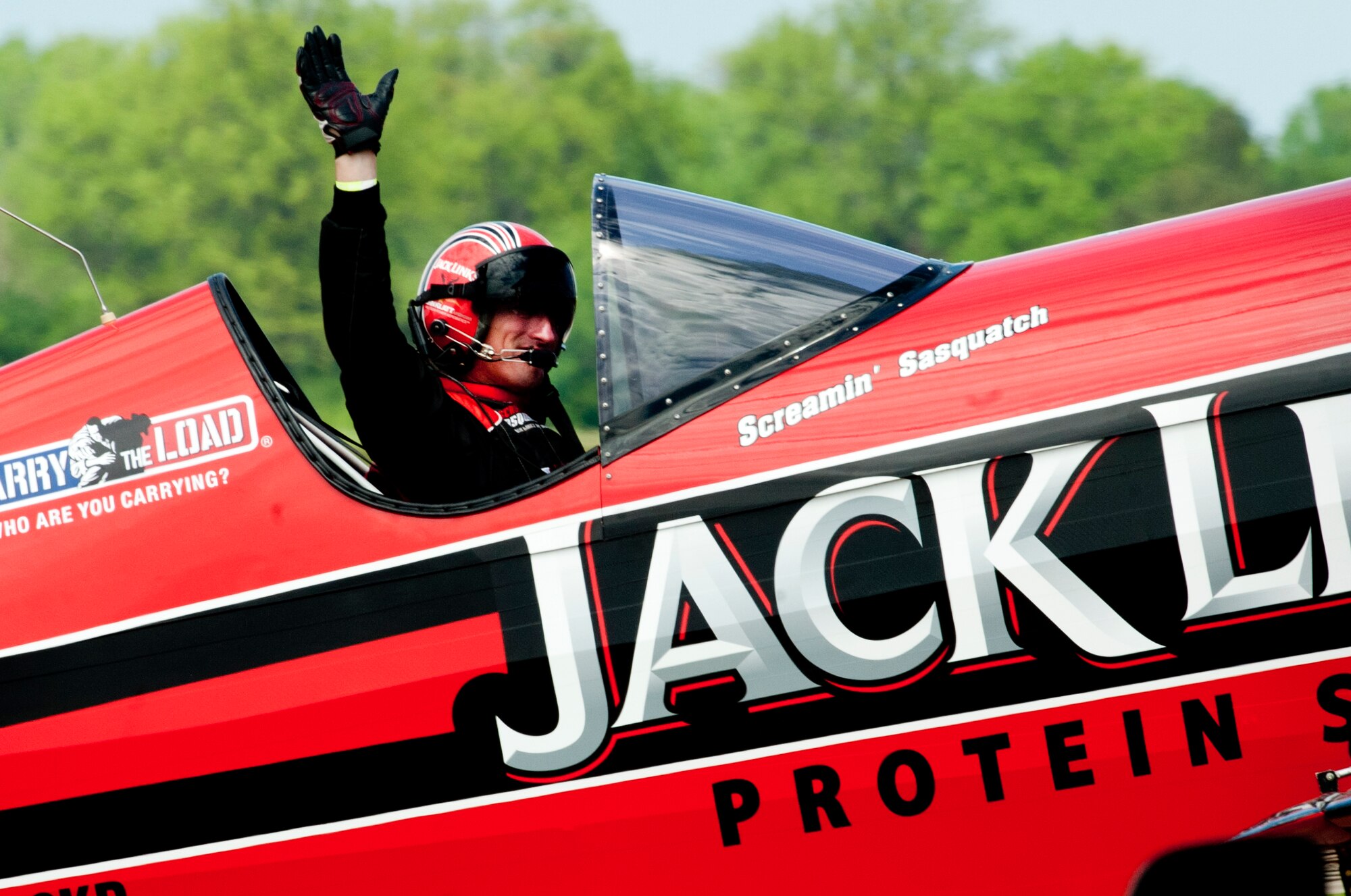 Jeff Boerboon, the Jack Link's Screamin' Sasquatch Jet Waco pilot, waves to the crowd following an aerial performance during the AirPower over Hampton Roads Open House at Langley Air Force Base, Va., April 23, 2016. The open house gave military and civilian personnel the opportunity to get up-close-and-personal with various aircraft and pilots, in addition to witnessing the Air Force’s past and present capabilities in airpower. (U.S. Air Force photo by Senior Airman R. Alex Durbin)