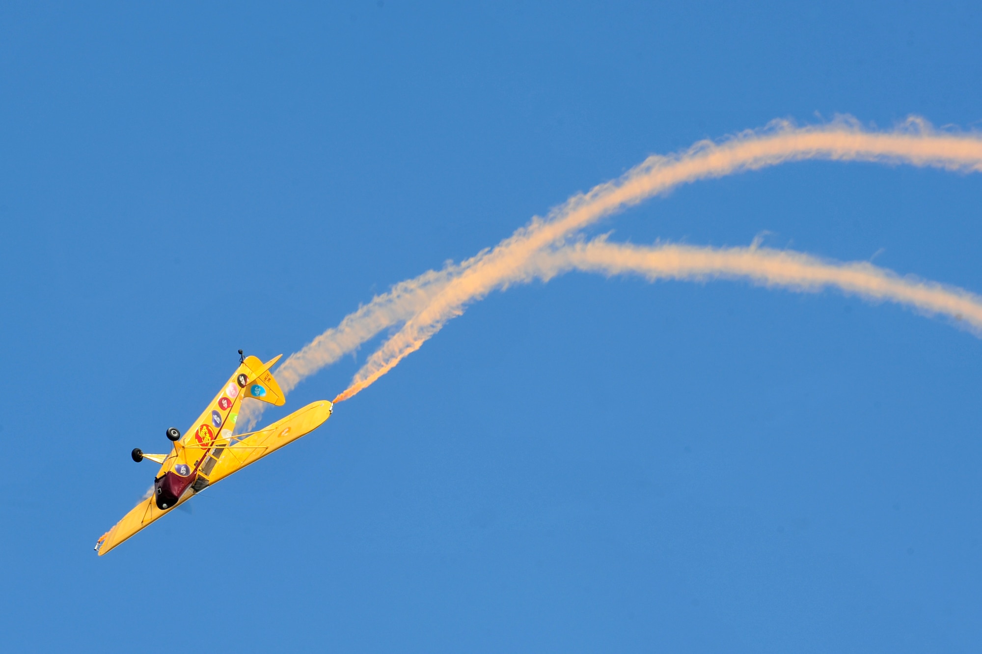 Kent Pietsch performs in the Jelly Belly Airplane during the AirPower over Hampton Roads Open House at Langley Air Force Base, Va., April 23, 2016. The open house was a free showcase of modern and historical military aircraft by civilian and military performers. (U.S. Air Force photo by Senior Airman R. Alex Durbin)