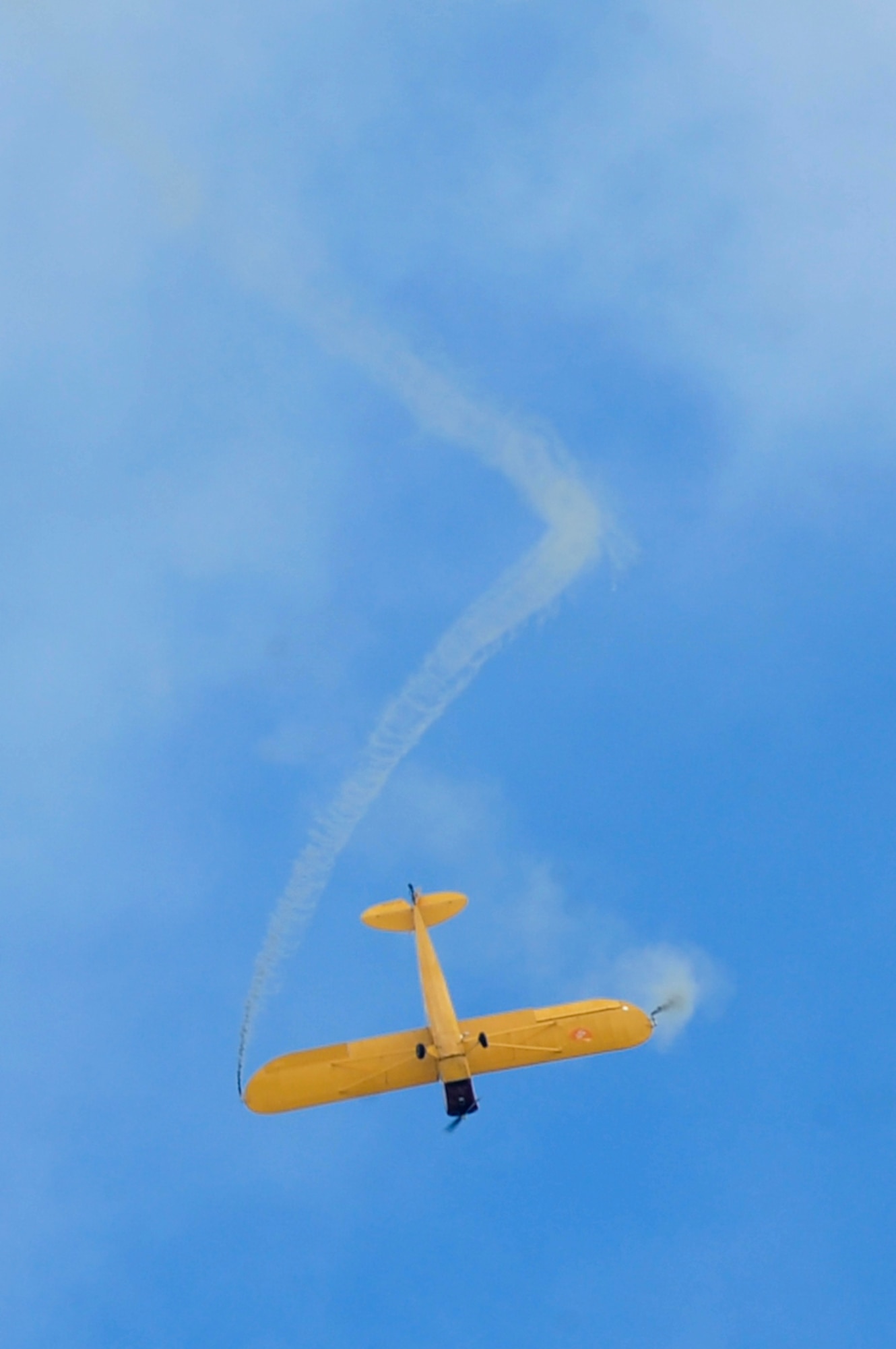 Kent Pietsch performs in the Jelly Belly Airplane during the AirPower over Hampton Roads Open House at Langley Air Force Base, Va., April 23, 2016. Pietsch flies an 800-pound Interstate Cadet and performed three distinct acts during the show. (U.S. Air Force photo by Senior Airman R. Alex Durbin)