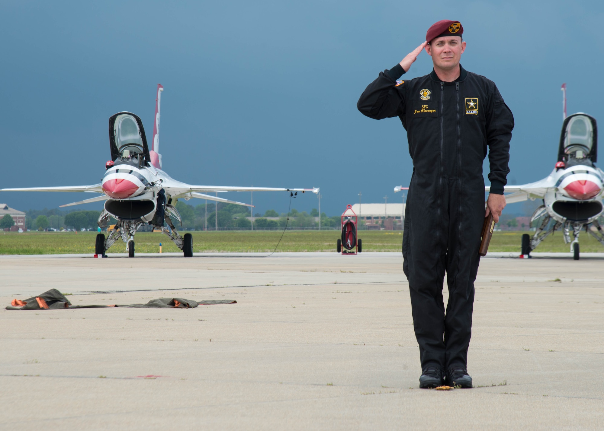 U.S. Army Sergeant 1st Class Jon Clevenger, a supply specialist assigned to the U.S. Army Golden Knights parachute team, salutes the crowd during the Airpower Over Hampton Roads Open House at Langley Air Force Base, Va., April 24, 2016. The demonstration teams, which use five dedicated aircraft, perform at more than 100 events per year. (U.S. Air Force Photo by Staff Sgt. J.D. Strong II)