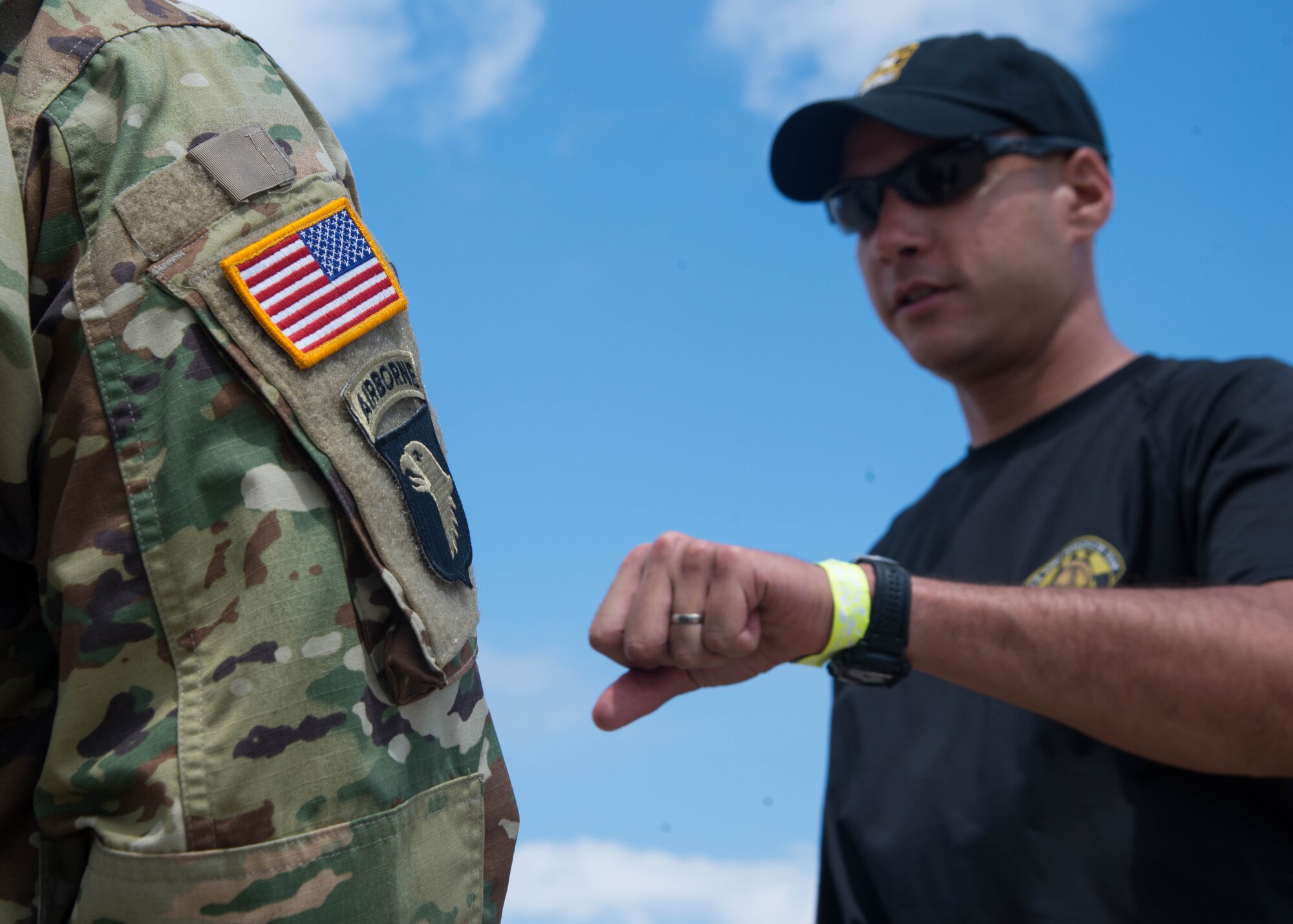 U.S. Army Staff Sgt. Francisco Gallegos, an Advance Individual Training instructor assigned to the 122nd Aviation Regiment, receives instruction on the baton pass from Master Sgt. Chris Parker, an aviation operator assigned to U.S. Army Golden Knights parachute team, during the Airpower Over Hampton Roads Open House at Langley Air Force Base, Va., April 24, 2016. Gallegos was selected to receive the baton from the Golden Knights for his exemplary service and being named the 2015 Fort Eustis Non-Commissioned Officer of the Year. (U.S. Air Force Photo by Staff Sgt. J.D. Strong II) 
