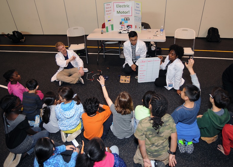 Engineers John Noll, Myles Esmele and Lilian Ukwute demonstrated principles of electricity and magnetism for the student of Humphreys Central Elementary School during Science, Technology, Engineering and Math day on April 19.
