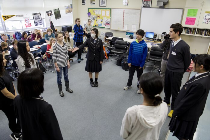 Students from Noda Gakuen High School in Yamaguchi City and Matthew C. Perry High School at Marine Corps Air Station Iwakuni, Japan, participate in a drama class at MCAS Iwakuni April 21, 2016. Events like these help secure the two nations’ relationship with positive activities that educate students about each other’s culture. (U.S. Marine Corps photo by Lance Cpl. Aaron Henson/Released)