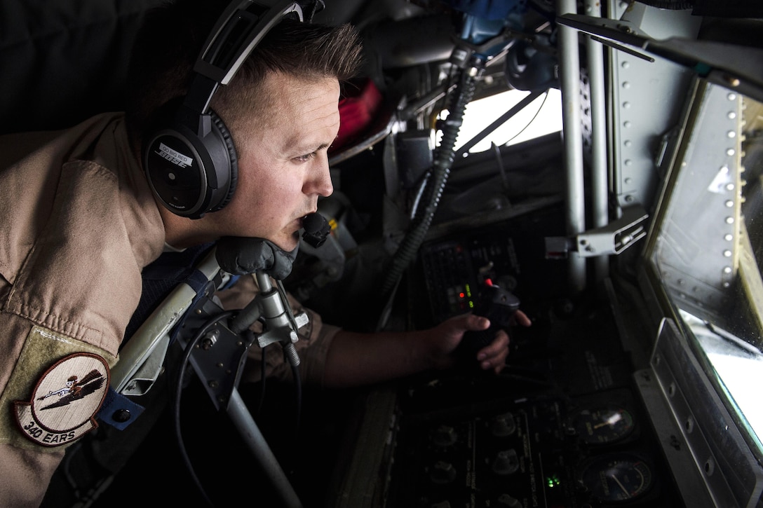 Air Force Tech Sgt. Matthew Prosser operates the boom of a U.S Air Force KC-135 Stratotanker aircraft over Iraq in support of Operation Inherent Resolve, April 8, 2016. Prosser is a boom operator assigned to the 340th Expeditionary Air Refueling Squadron, deployed from the 185th Air Refueling Wing, Iowa Air National Guard. Air Force photo by Staff Sgt. Corey Hook