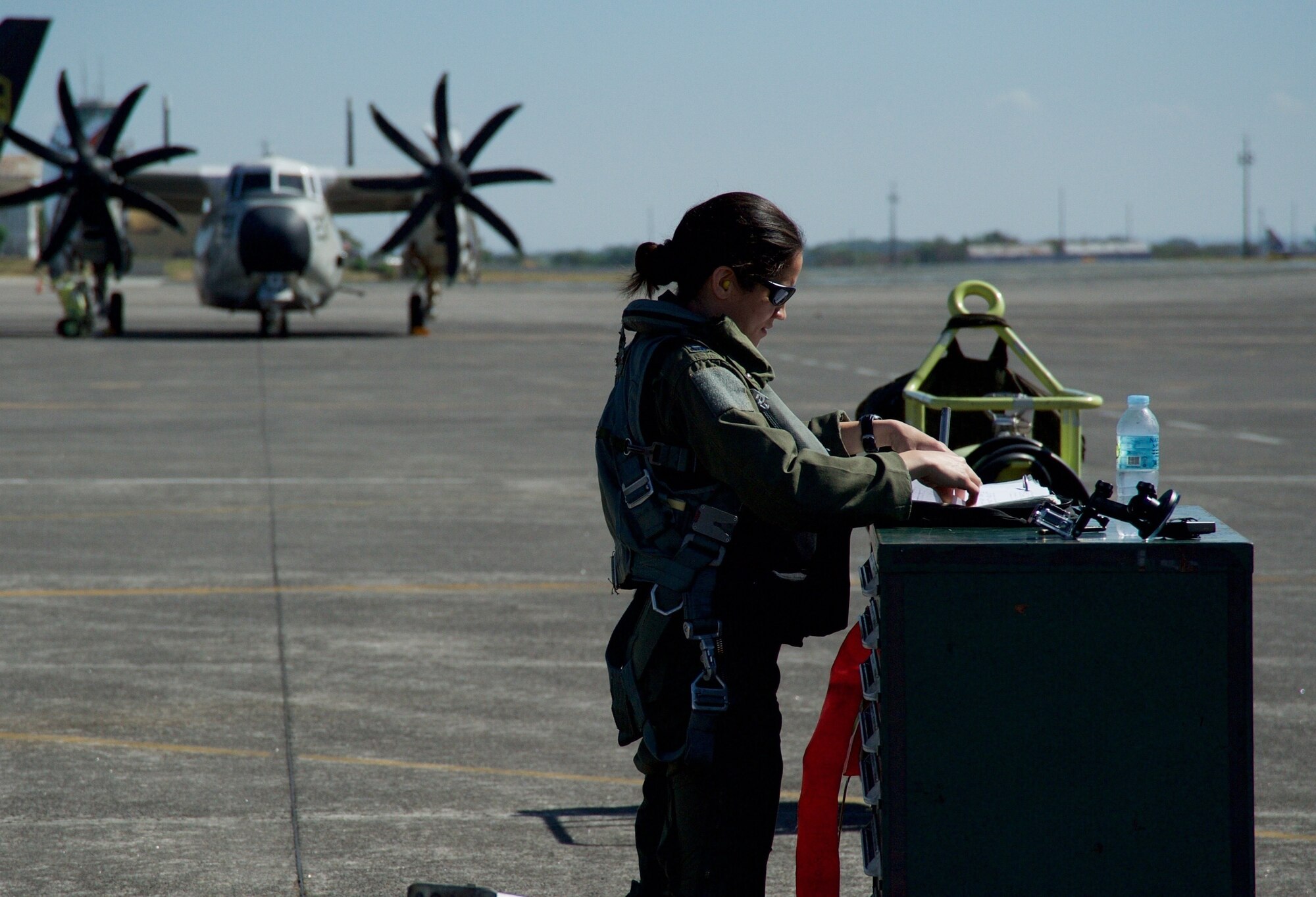 U.S. Air Force Capt. Stella Glojek reviews an A-10C Thunderbolt II aircraft maintenance record before taking off from Clark Air Base, Philippines, on a maritime domain awareness mission in the vicinity of Scarborough Shoal April 21, 2016. These missions are designed to provide greater and more transparent air and maritime situational awareness to ensure safety for military and civilian activities in international waters and airspace. Additionally, the A-10 presence enhances the presence of U.S. military assets in the region upholding freedom of navigation and over flight. (U.S. Air Force photo by Capt. Susan Harrington)