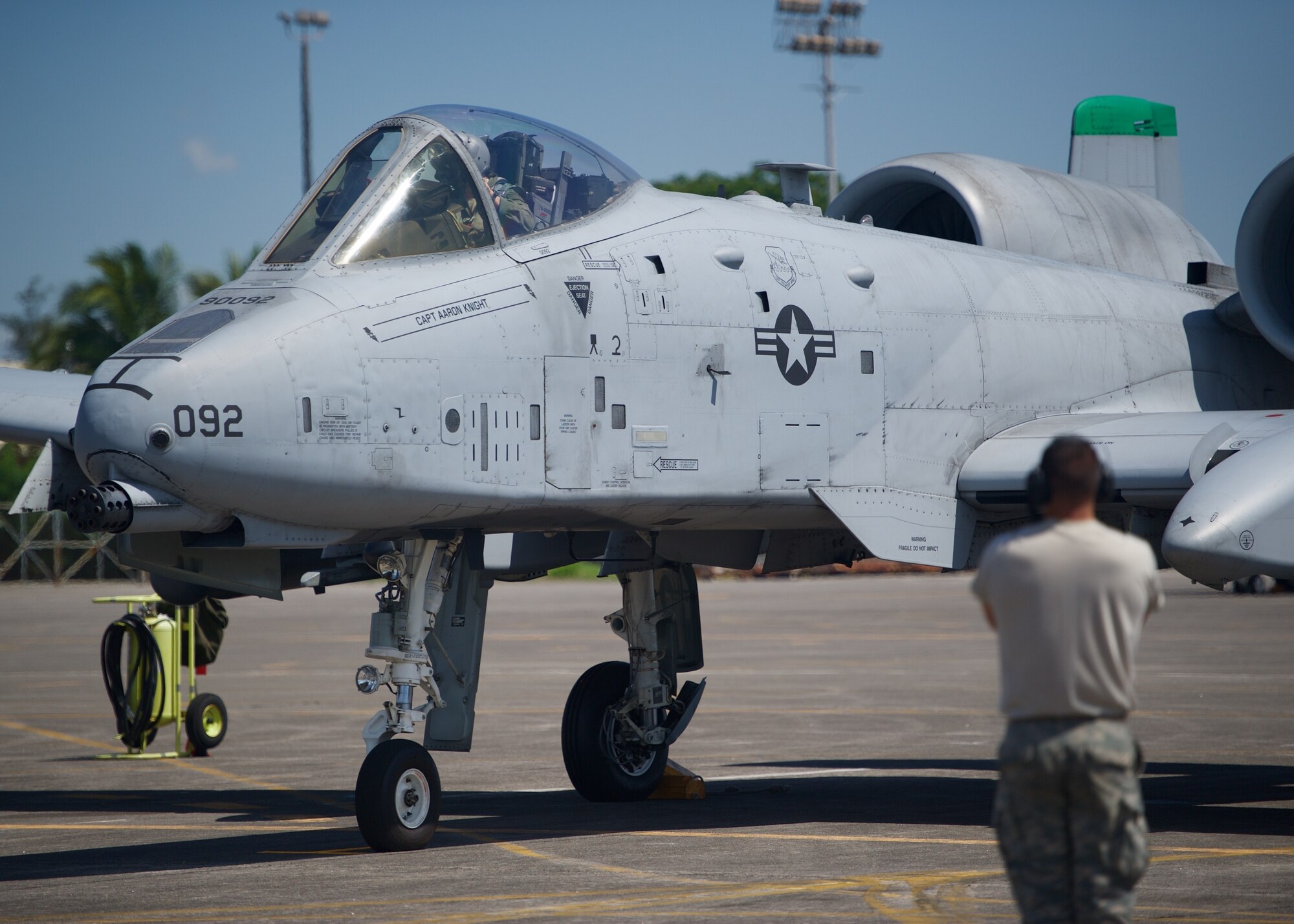 U.S. Air Force Senior Airman Daniel Bates, an A-10C Thunderbolt II crew chief marshals Capt. John Meyers, before taking off from Clark Air Base, Philippines, on a maritime domain awareness mission in the vicinity of Scarborough Shoal April 21, 2016. Meyers and Bates are both deployed from Osan Air Base, Republic of Korea, along with five A-10Cs, three HH-60G Pave Hawks and 200 Airmen as part of U.S. Pacific Command’s first Air Contingent, which was stood up at the invitation of the Philippines government in order to promote interoperability and provide credible combat forces to the Indo-Asia-Pacific capable of a variety of missions including force projection, air and maritime domain awareness, personnel recovery, combating piracy, and assuring access to the air and maritime domains in accordance with international law. (U.S. Air Force photo by Capt. Susan Harrington)