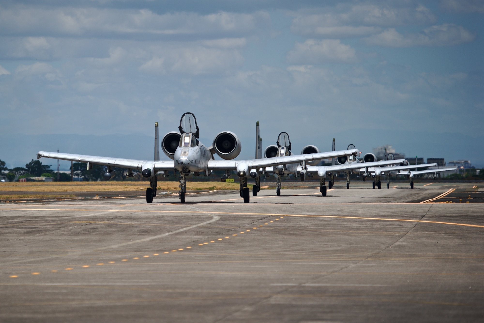 Four U.S. Air Force A-10C Thunderbolt II aircraft taxi down the runway at Clark Air Base, Philippines, after completing an air and maritime domain awareness mission in the vicinity of Scarborough Shoal April 21, 2016. These aircraft are part of U.S. Pacific Command’s l Air Contingent designed to promote interoperability and provide greater and more transparent air and maritime situational awareness to ensure safety for military and civilian activities in international waters and airspace. The AMDA missions the A-10C’s conduct enhances the ongoing maritime situational awareness missions that have been carried out by the U.S. Navy’s P-8 deployments to Clark for a number of years. (U.S. Air Force photo by Capt. Susan Harrington)