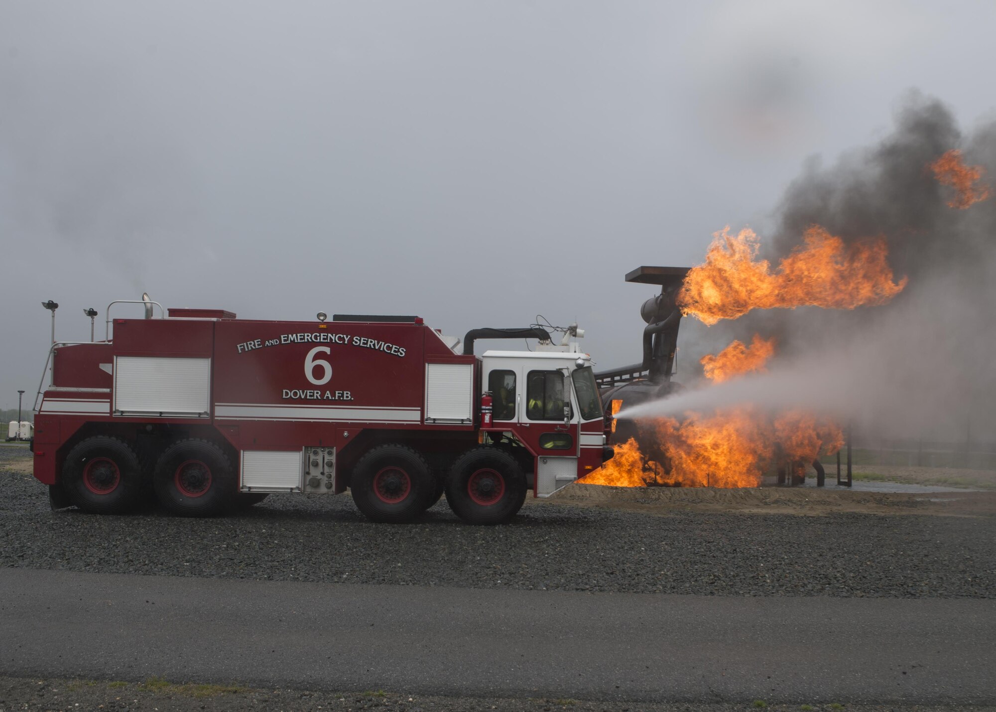 Airmen with the 512th Airlift Wing train fire-fighting skills as they extinguish an aircraft fire at Dover Air Force Base, Del., April 23, 2016. This training occurs twice a year to keep the fire fighters current and proficient in their training requirements. (U.S. Air Force photo by Tech. Sgt. Nathan Rivard)
