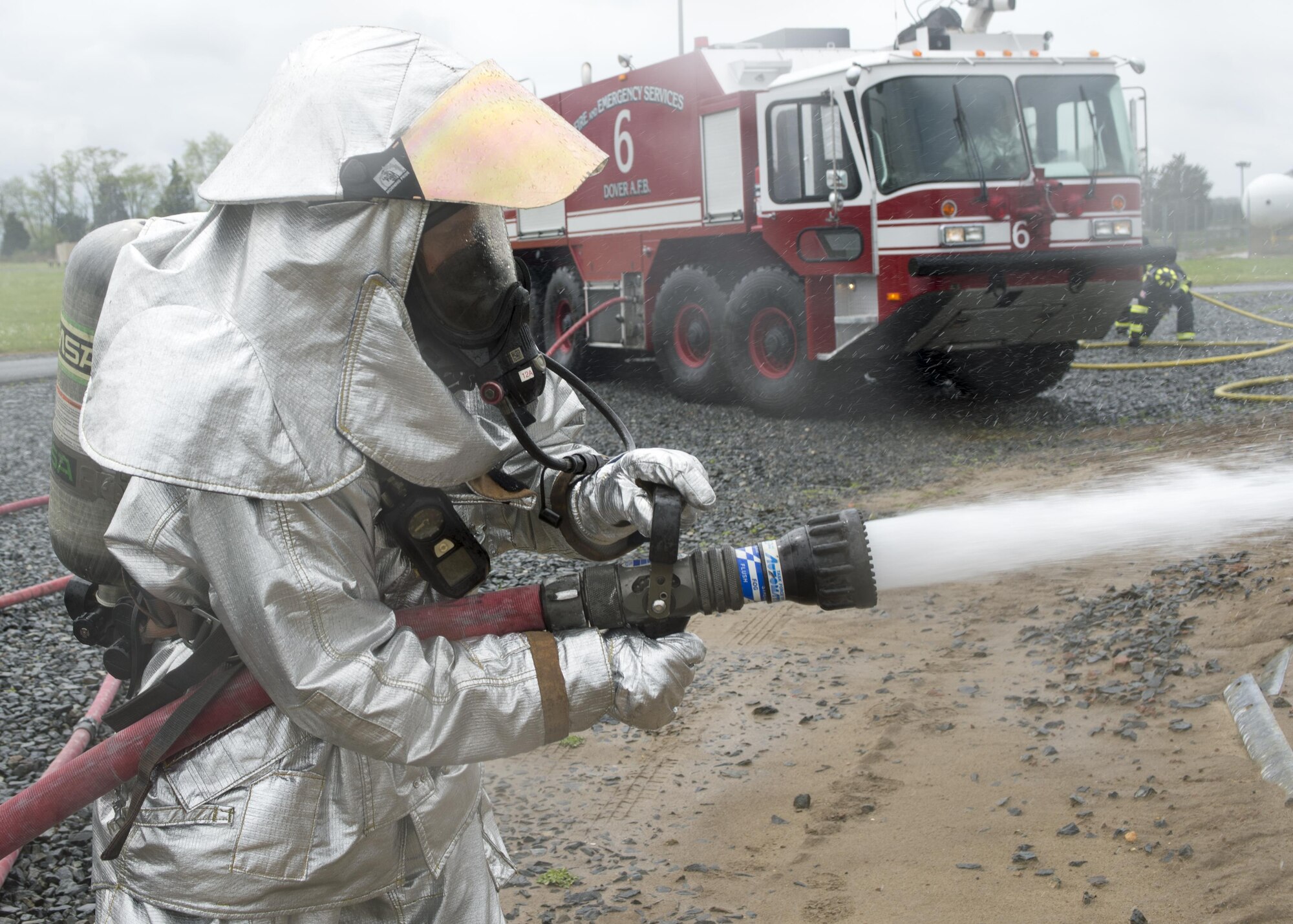 Airmen with the 512th Airlift Wing train fire-fighting skills as they extinguish an aircraft fire at Dover Air Force Base, Del., April 23, 2016. This training occurs twice a year to keep the fire fighters current and proficient in their training requirements. (U.S. Air Force photo by Tech. Sgt. Nathan Rivard)