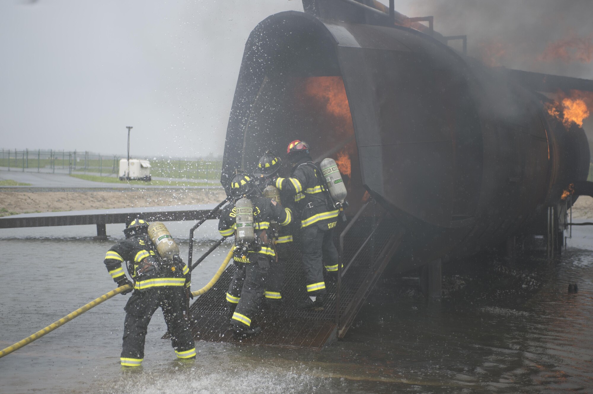 Airmen with the 512th Airlift Wing train fire-fighting skills as they extinguish an aircraft fire at Dover Air Force Base, Del., April 23, 2016. This training occurs twice a year to keep the fire fighters current and proficient in their training requirements. (U.S. Air Force photo by Tech. Sgt. Nathan Rivard)