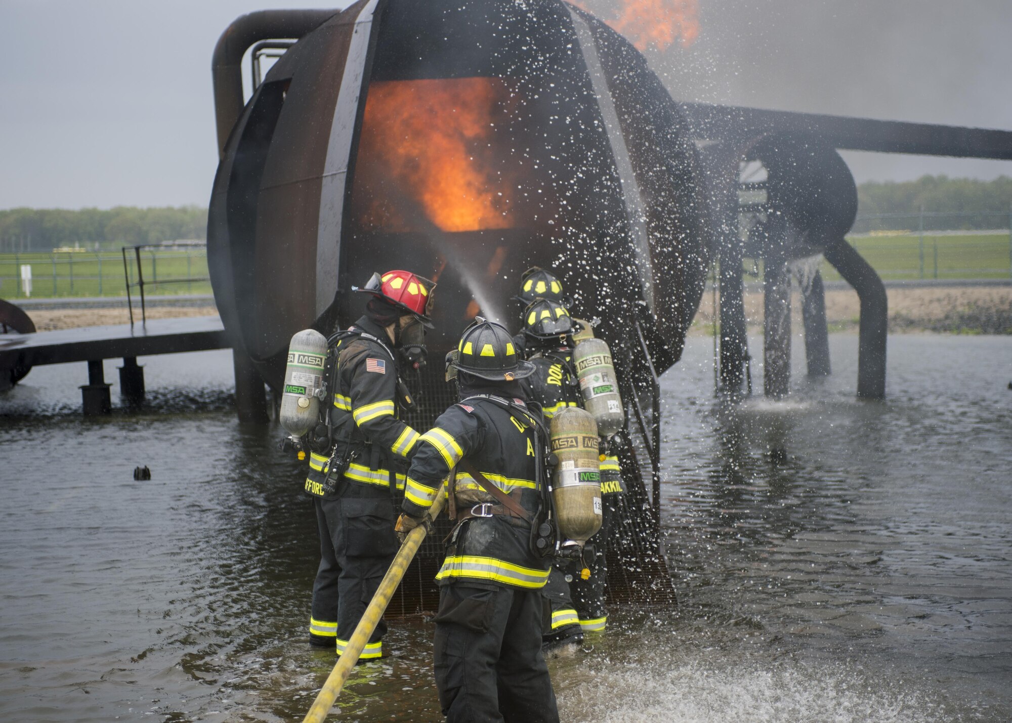 Airmen with the 512th Airlift Wing train fire-fighting skills as they extinguish an aircraft fire at Dover Air Force Base Del., April 23, 2016. This training occurs twice a year to keep the fire fighters current and proficient in their training requirements. (U.S. Air Force photo by Tech. Sgt. Nathan Rivard)