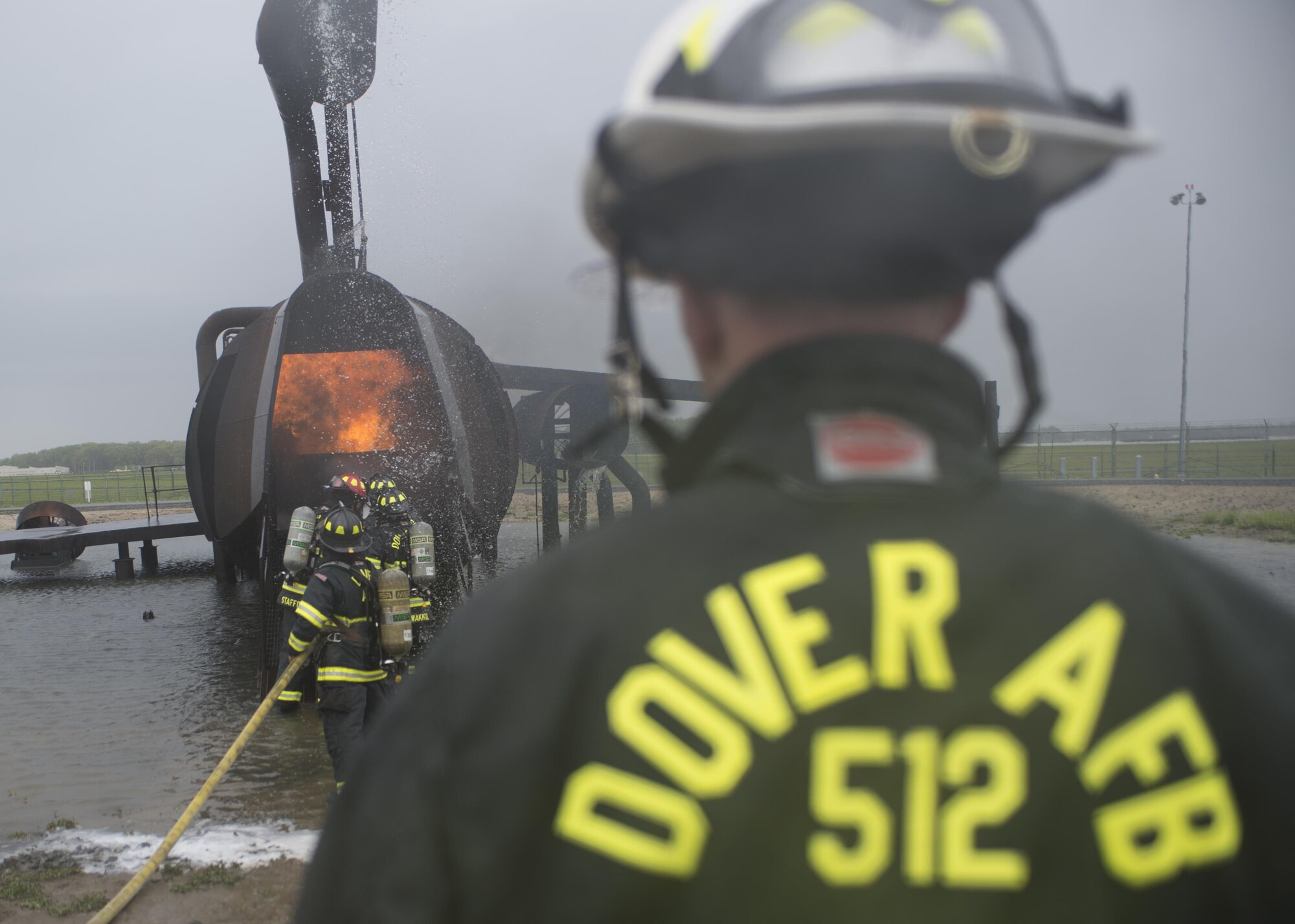 Airmen with the 512th Airlift Wing train fire-fighting skills as they extinguish an aircraft fire at Dover Air Force Base Del., April 23, 2016. This training occurs twice a year to keep the fire fighters current and proficient in their training requirements. (U.S. Air Force photo by Tech. Sgt. Nathan Rivard)