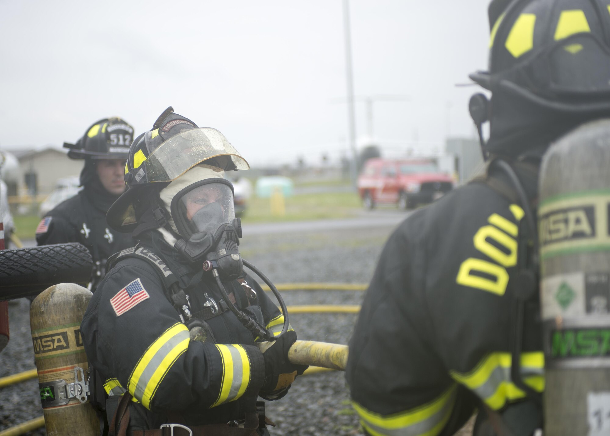 Col. Laura Radley, Mission Support Group commander, suits up and joins her Airmen during firefighter training at Dover Air Force Base, Del., April 23, 2016. This training occurs twice a year to keep the fire fighters current and proficient in their training requirements. (U.S. Air Force photo by Tech. Sgt. Nathan Rivard)