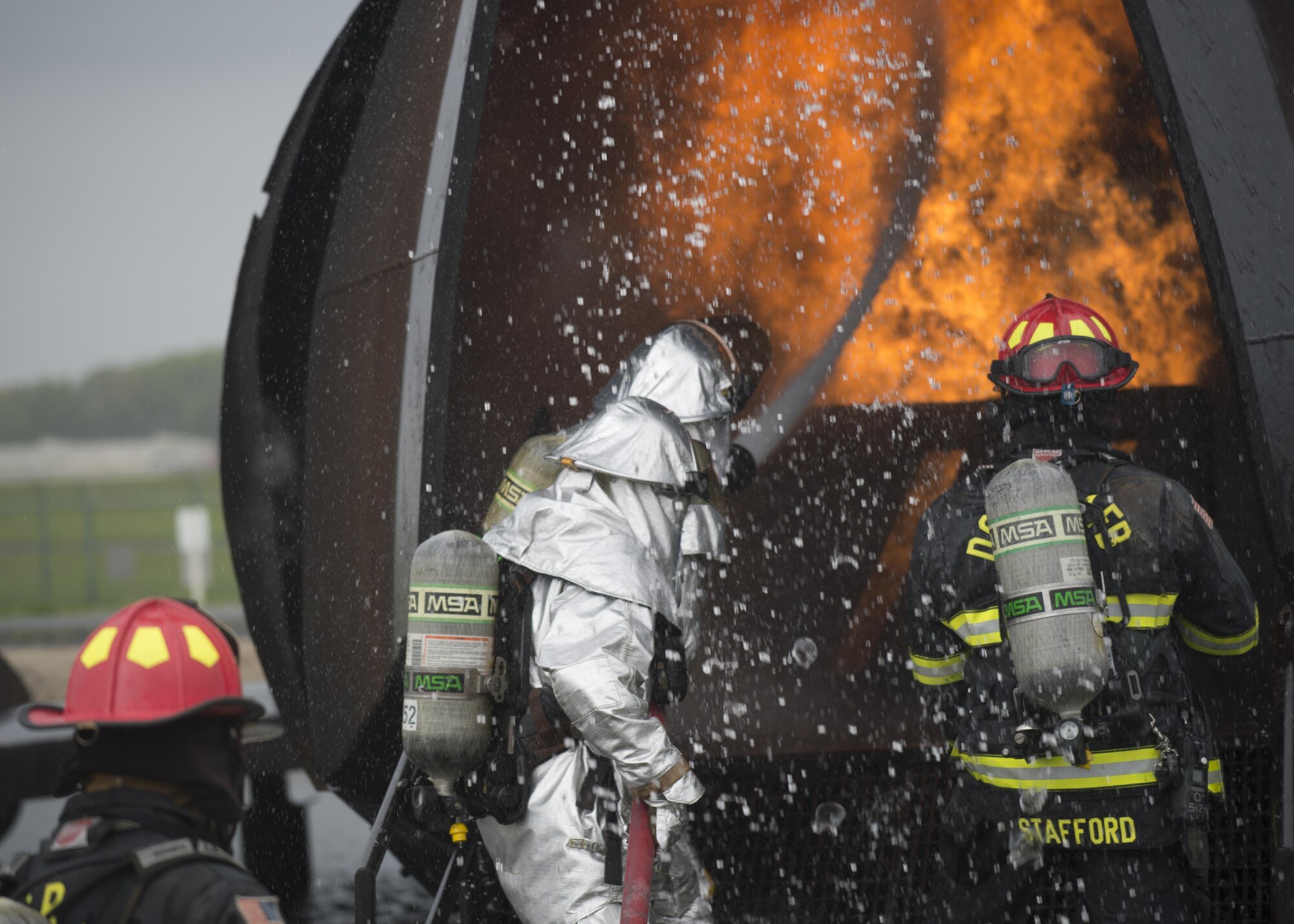 Airmen with the 512th Airlift Wing train fire-fighting skills as they extinguish an aircraft fire at Dover Air Force Base Del., April 23, 2016. This training occurs twice a year to keep the fire fighters current and proficient in their training requirements. (U.S. Air Force photo by Tech. Sgt. Nathan Rivard)