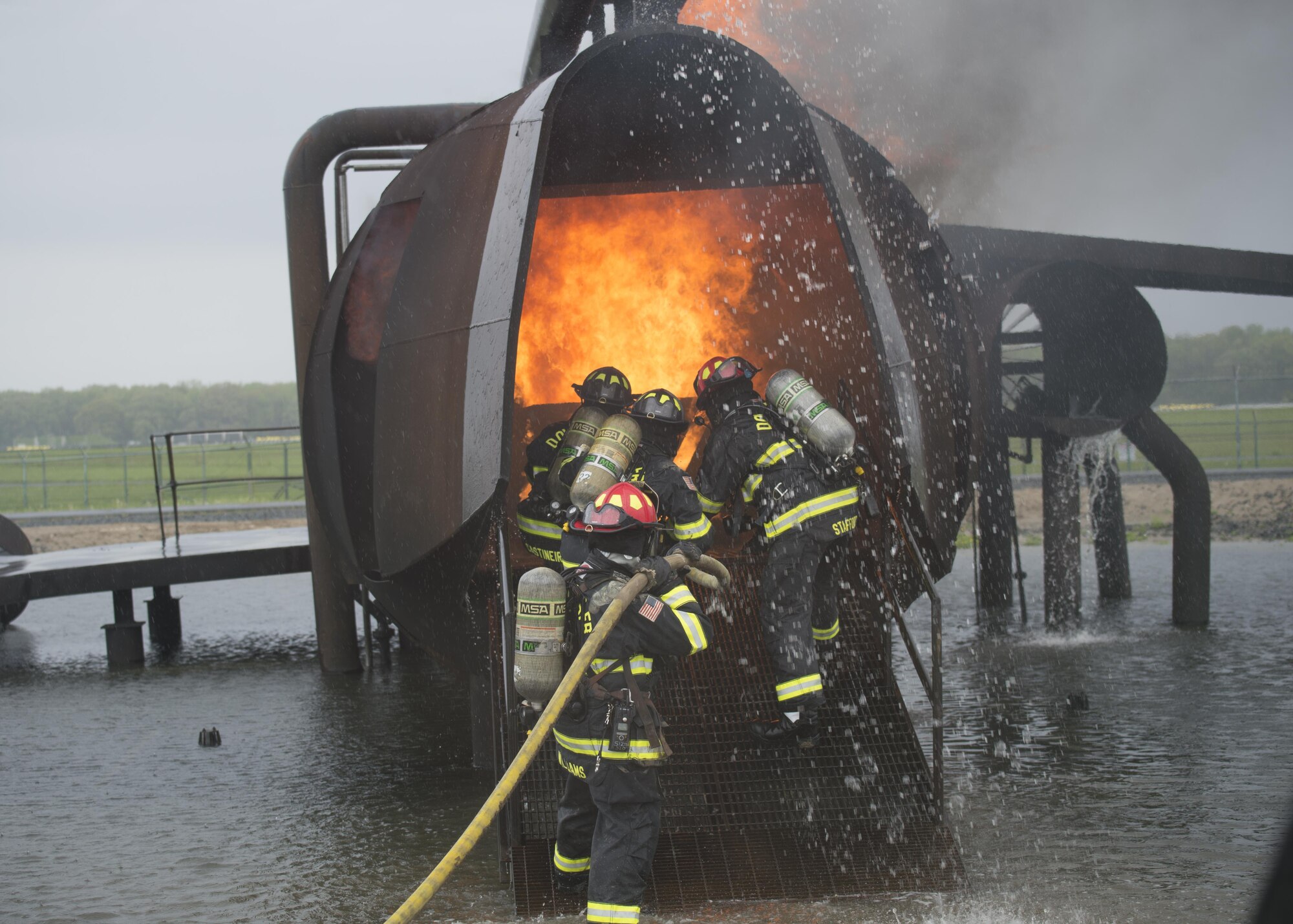 Airmen with the 512th Airlift Wing train fire-fighting skills as they extinguish an aircraft fire at Dover Air Force Base Del., April 23, 2016. This training occurs twice a year to keep the fire fighters current and proficient in their training requirements. (U.S. Air Force photo/Tech. Sgt. Nathan Rivard)