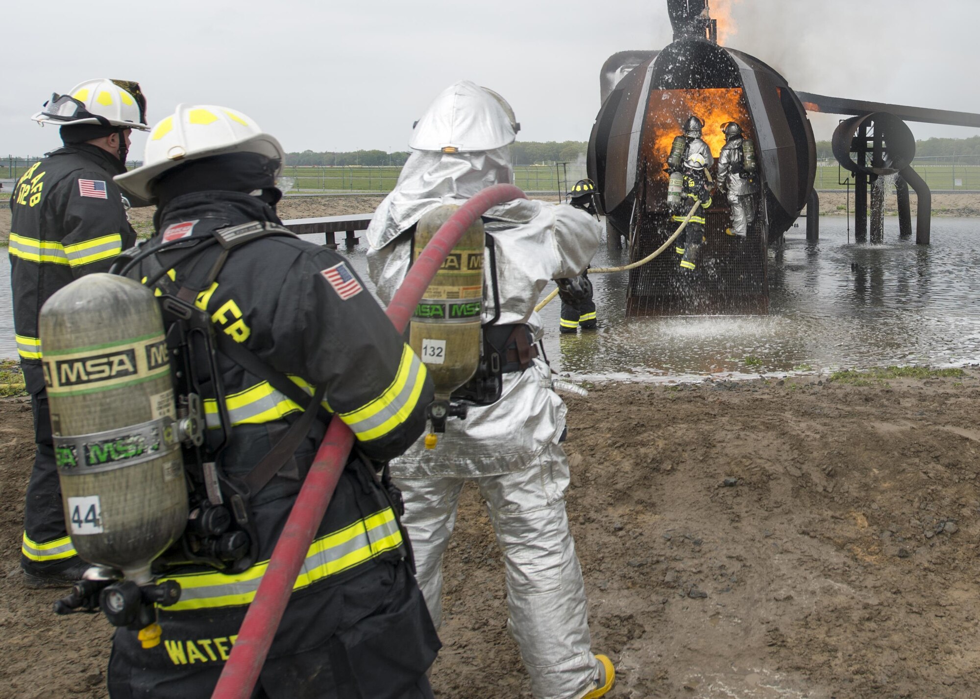 Airmen with the 512th Airlift Wing train fire-fighting skills as they extinguish an aircraft fire at Dover Air Force Base Del., April 23, 2016. This training occurs twice a year to keep the fire fighters current and proficient in their training requirements. (U.S. Air Force photo byTech. Sgt. Nathan Rivard)